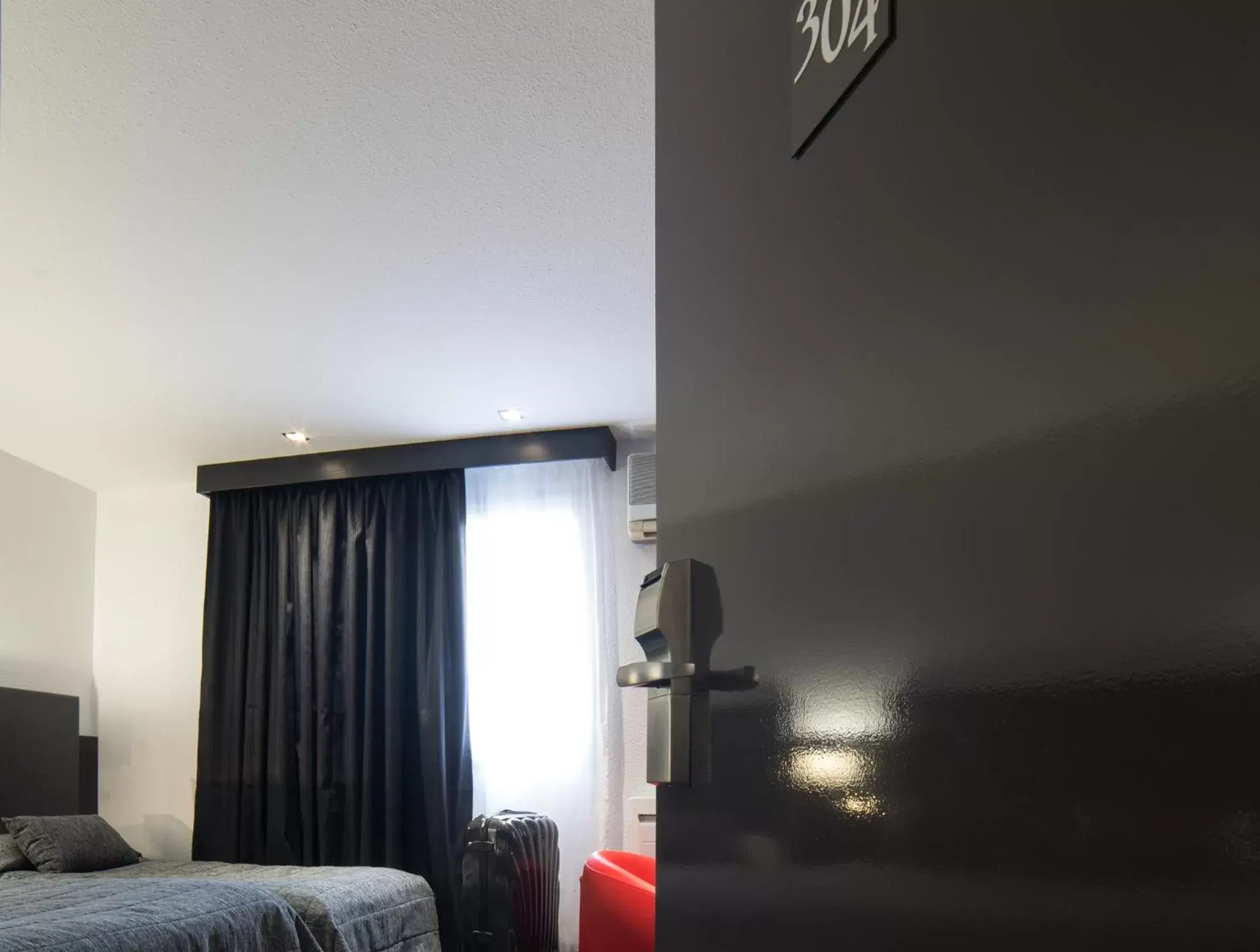 Bedroom in Cit'Hotel Stim'Otel