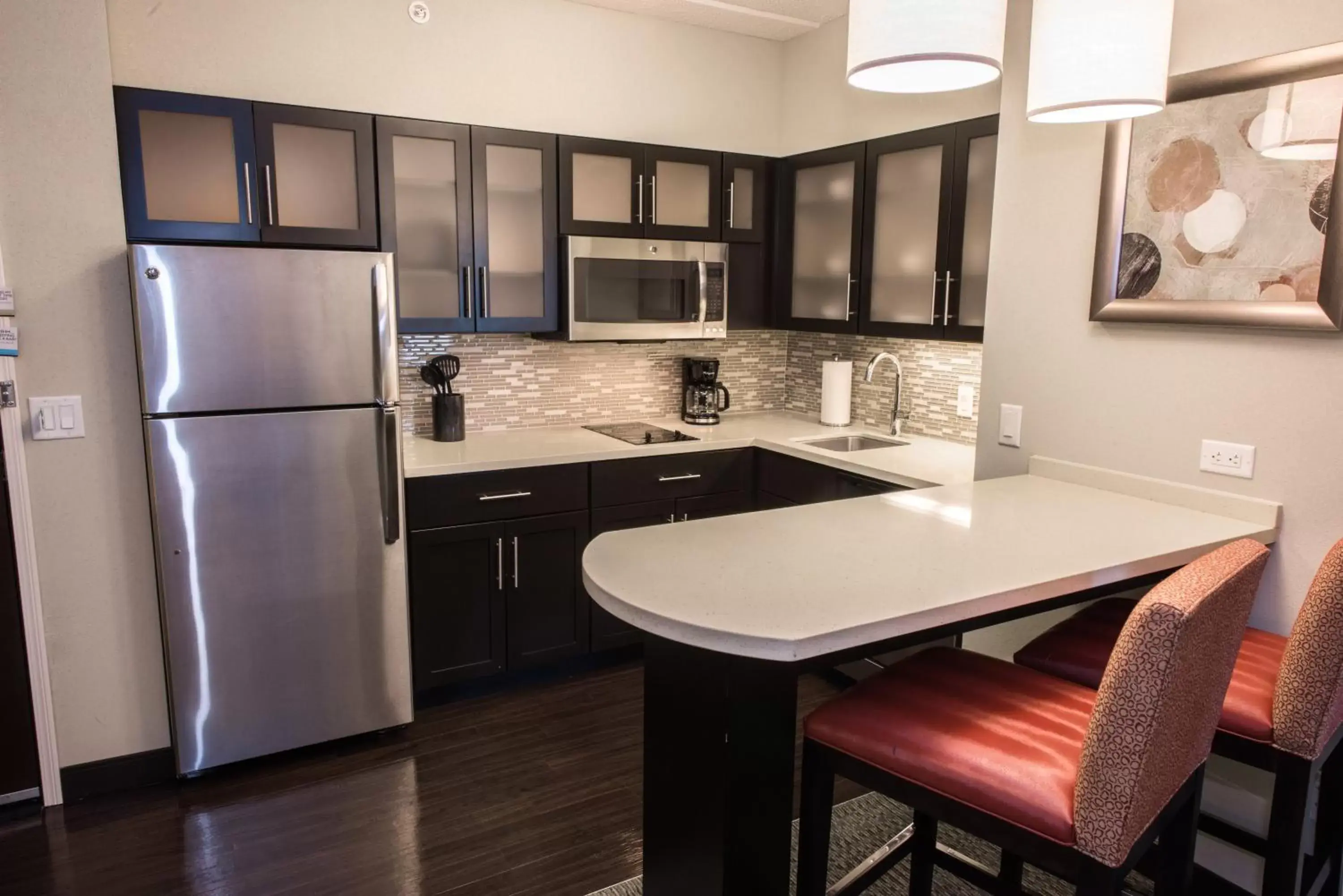 Photo of the whole room, Kitchen/Kitchenette in Staybridge Suites Albany Wolf Rd-Colonie Center, an IHG Hotel