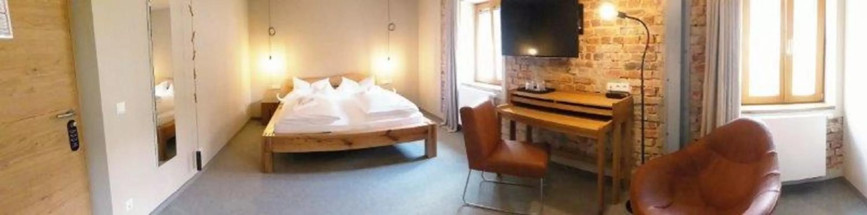 Seating area, Bed in Berghotel Sammüller