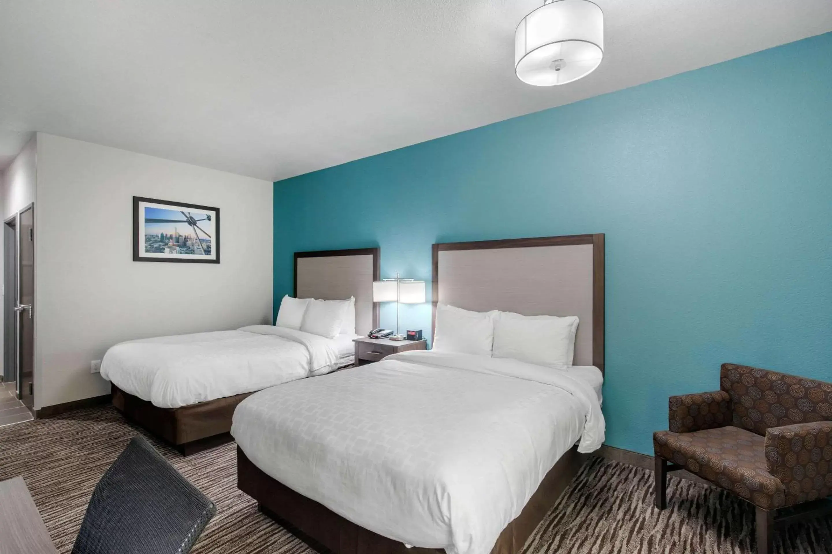 Photo of the whole room, Bed in Clarion Inn & Suites DFW North