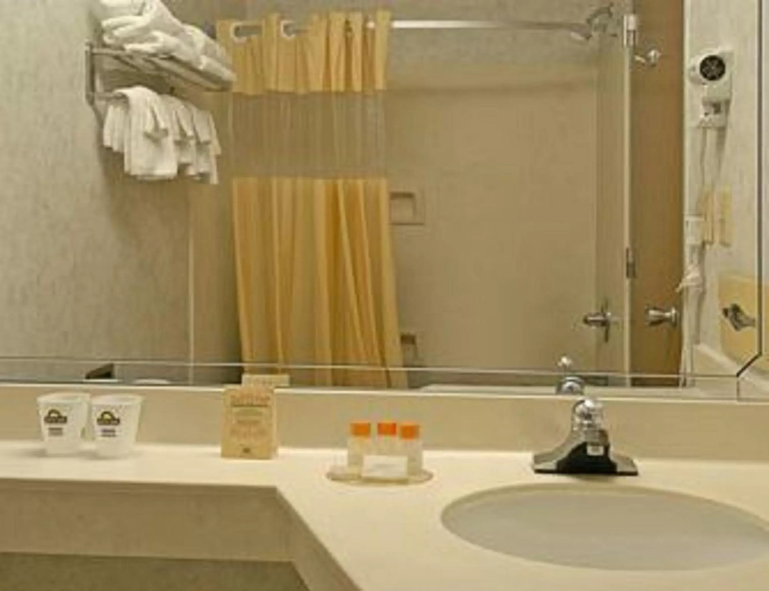 Bathroom in Days Inn & Suites by Wyndham Lexington