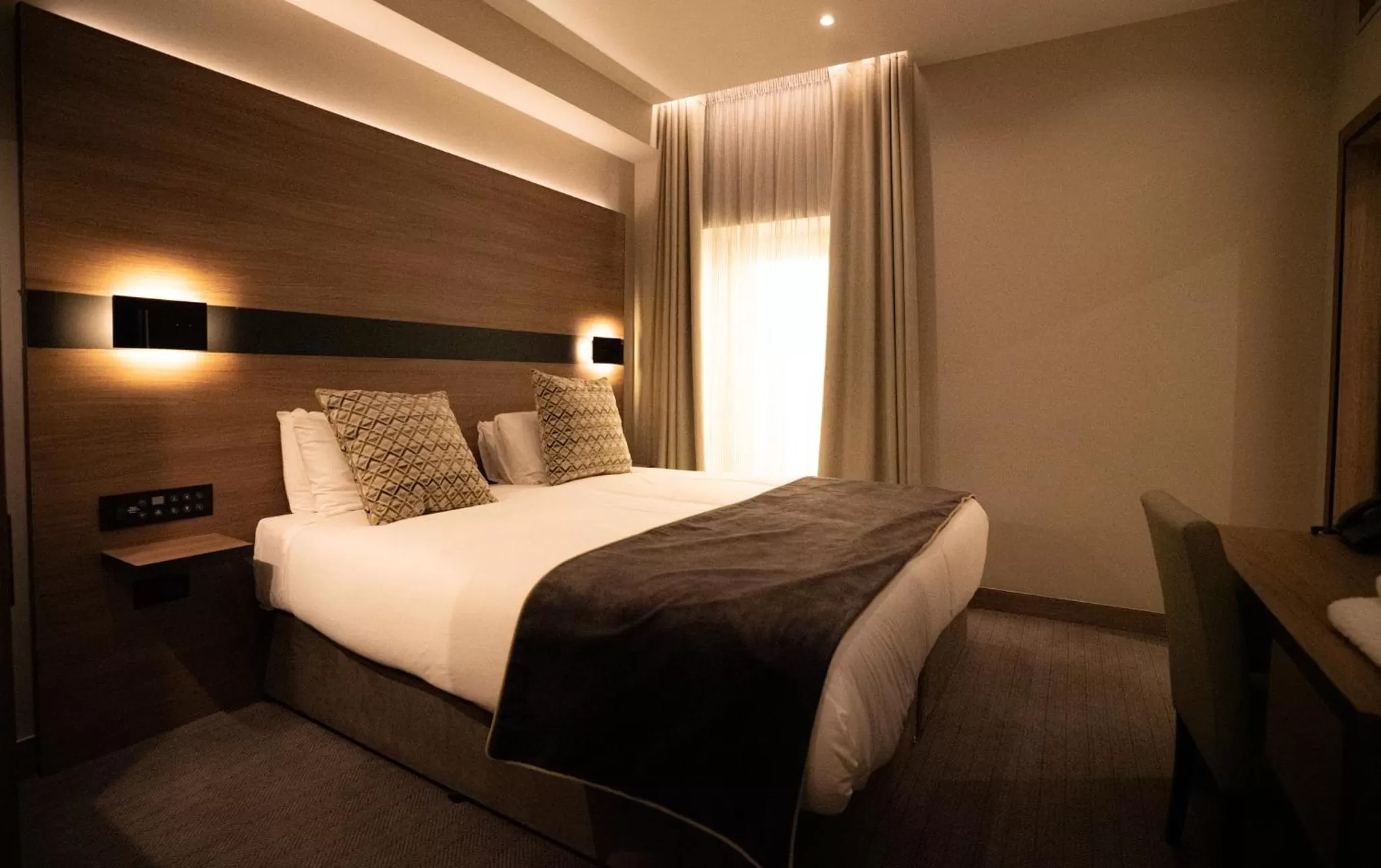 Bed in Merit Kensington Hotel