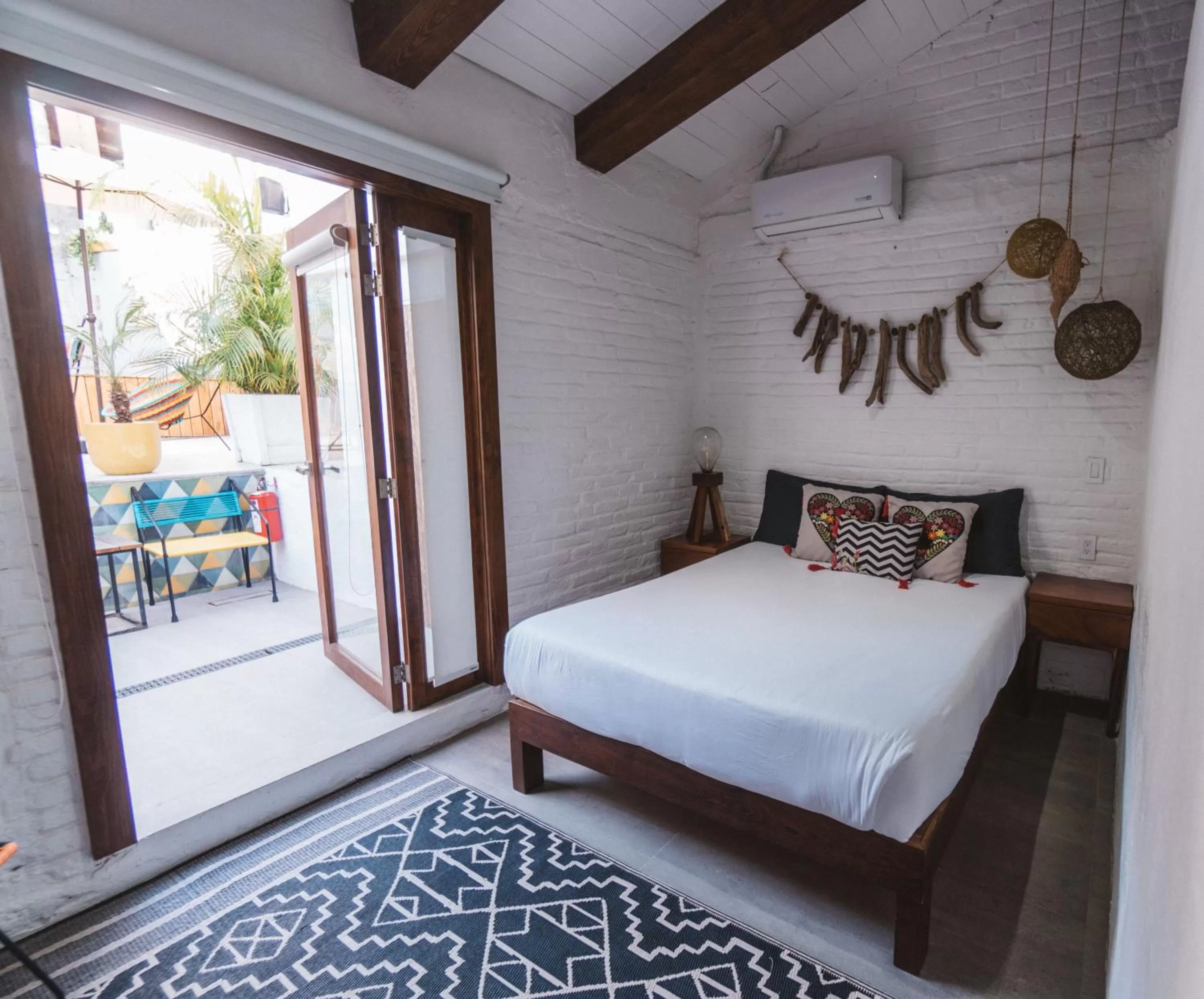 Bed in Amaia Boutique Hotel