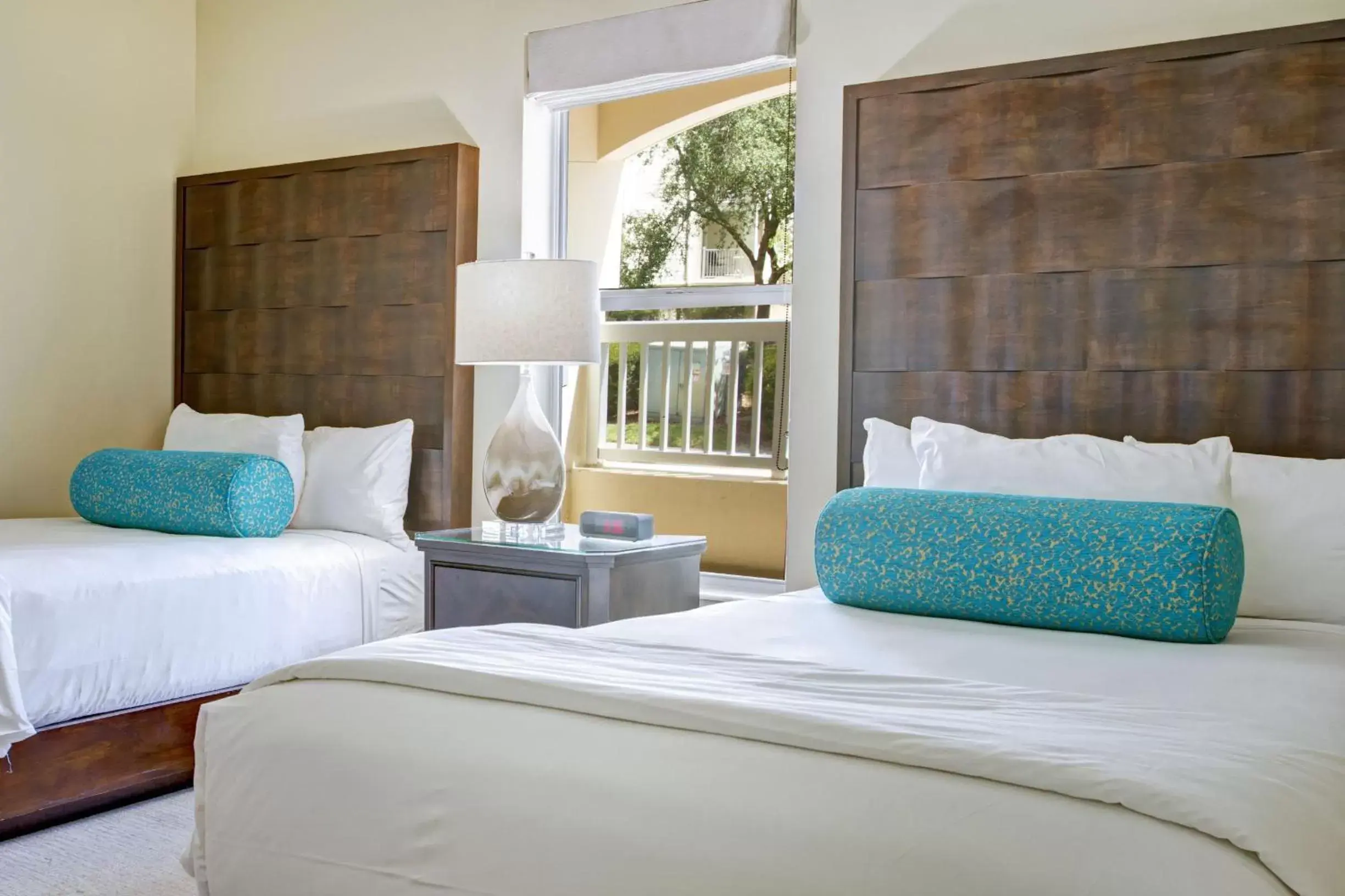 Guests, Bed in Summer Bay Orlando by Exploria Resorts