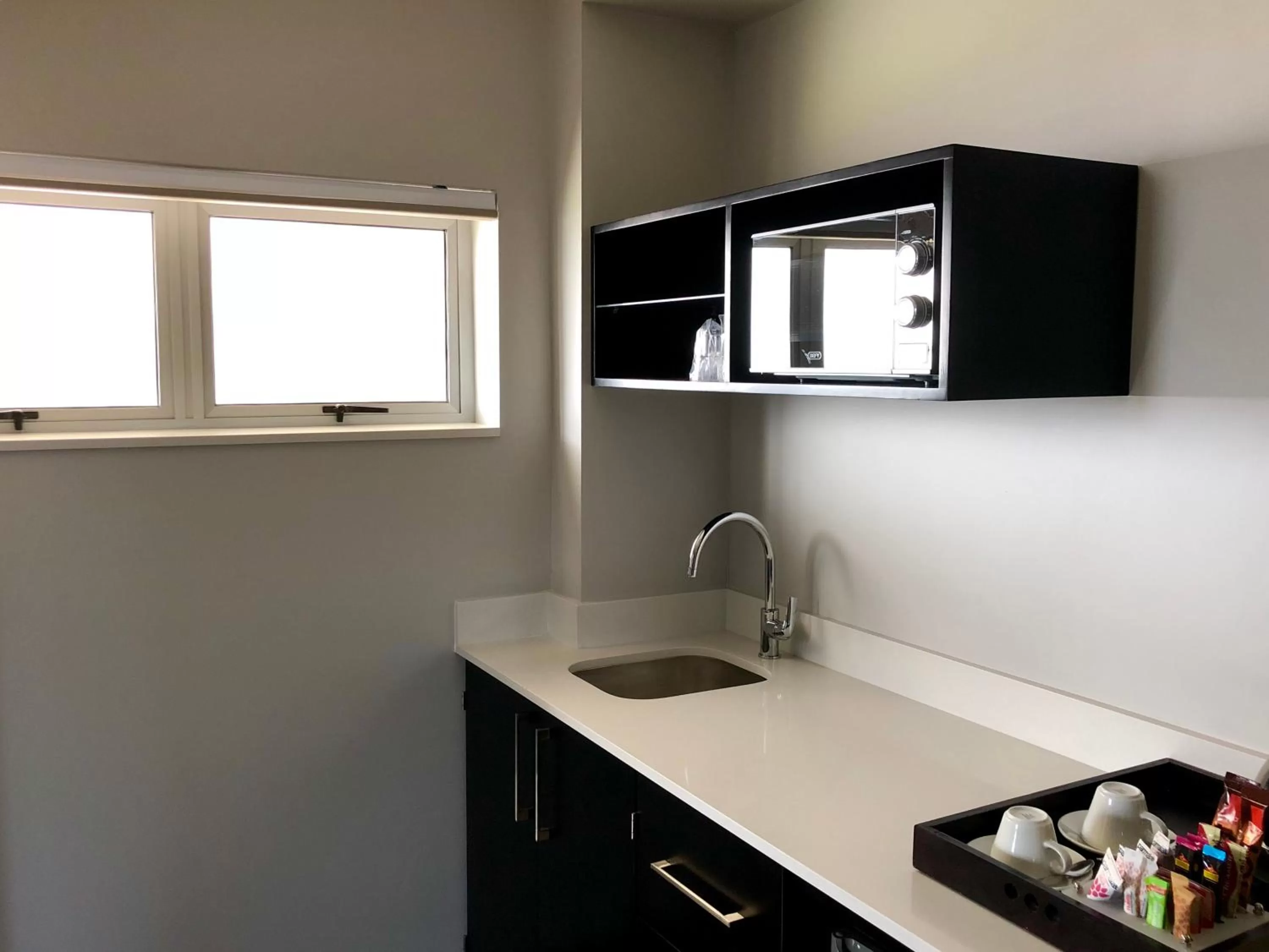 Kitchen or kitchenette in Belaire Suites Hotel