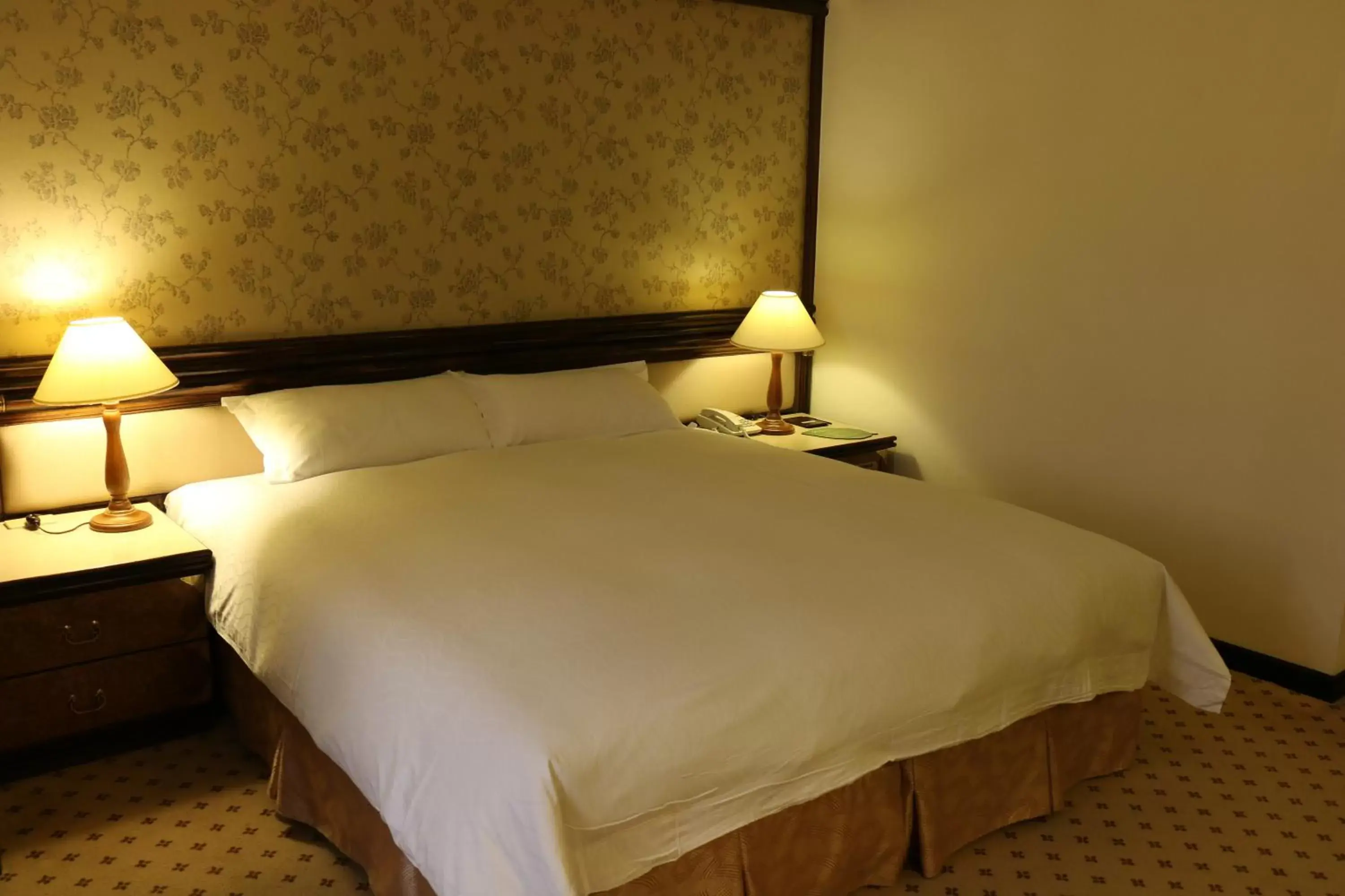 Bed in King's Town Hotel