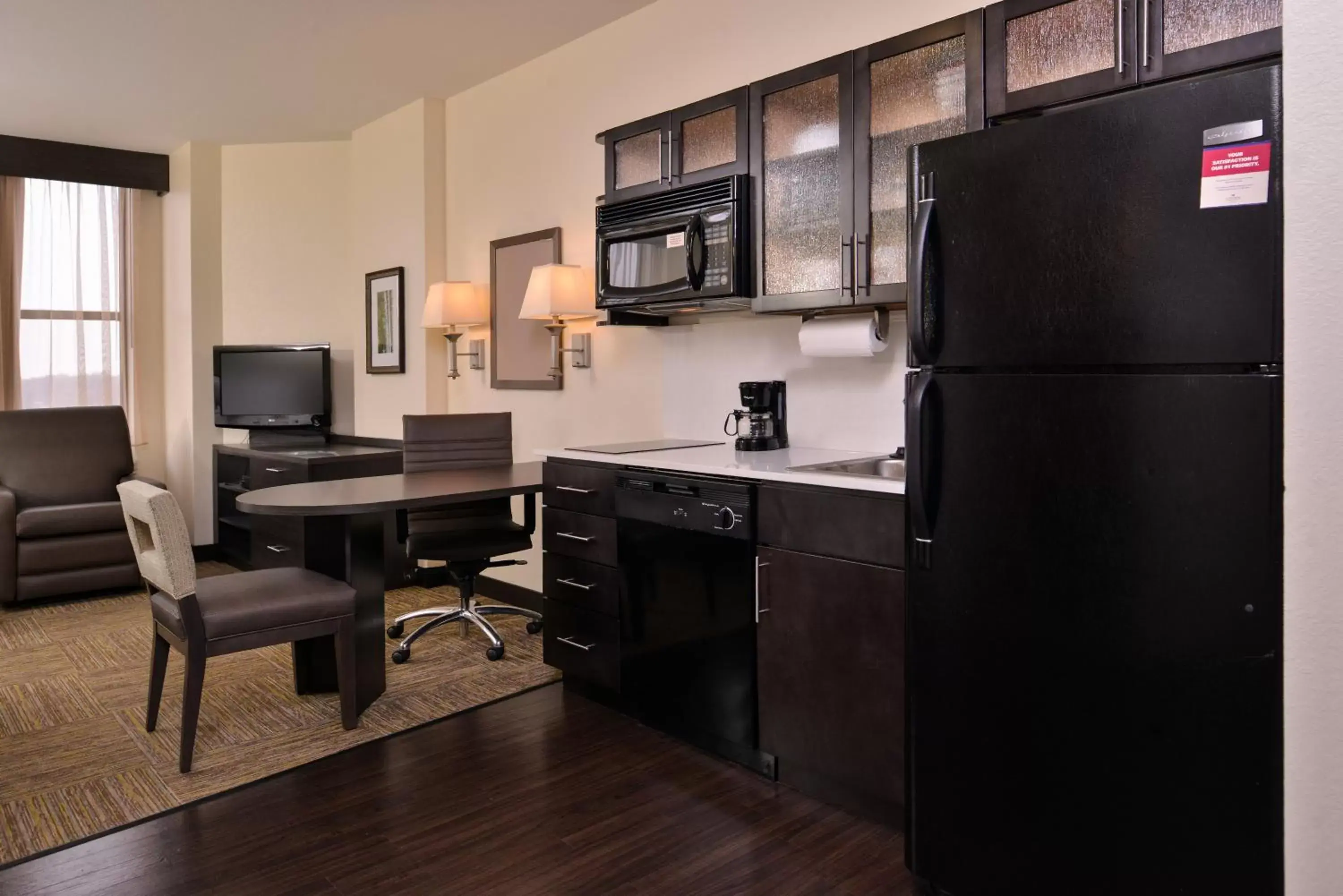 Photo of the whole room, Kitchen/Kitchenette in Candlewood Suites Terre Haute, an IHG Hotel