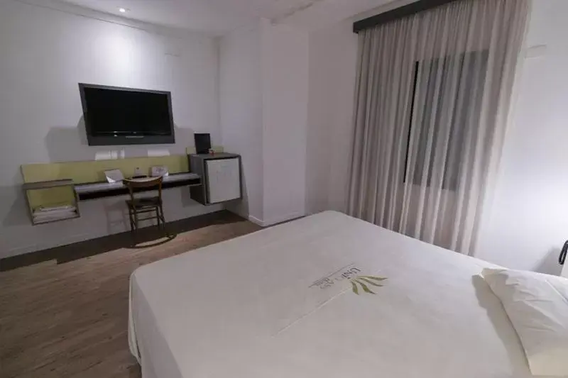 Bed in Uniclass Hotel Pinheiros