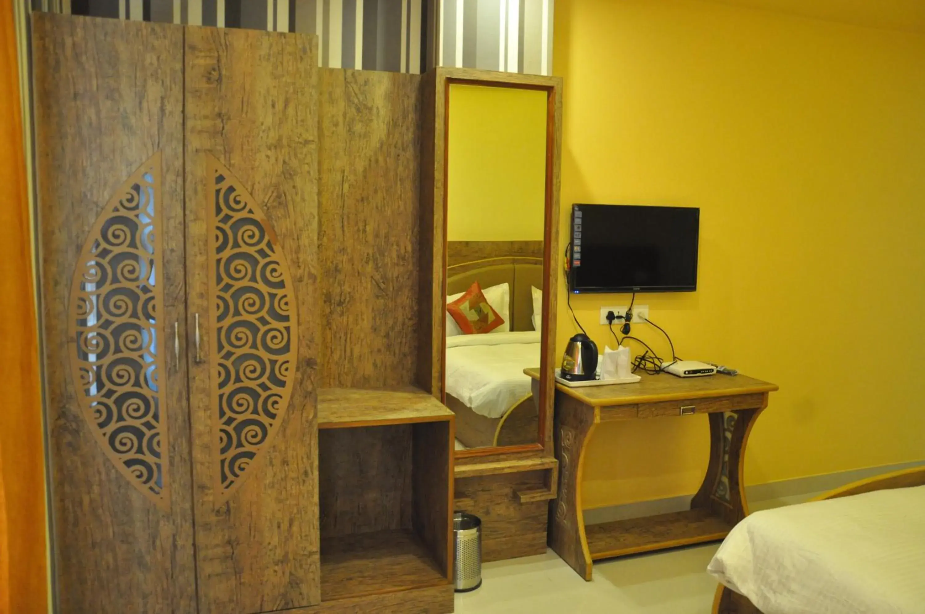 Bedroom, TV/Entertainment Center in Hotel Banaras Haveli