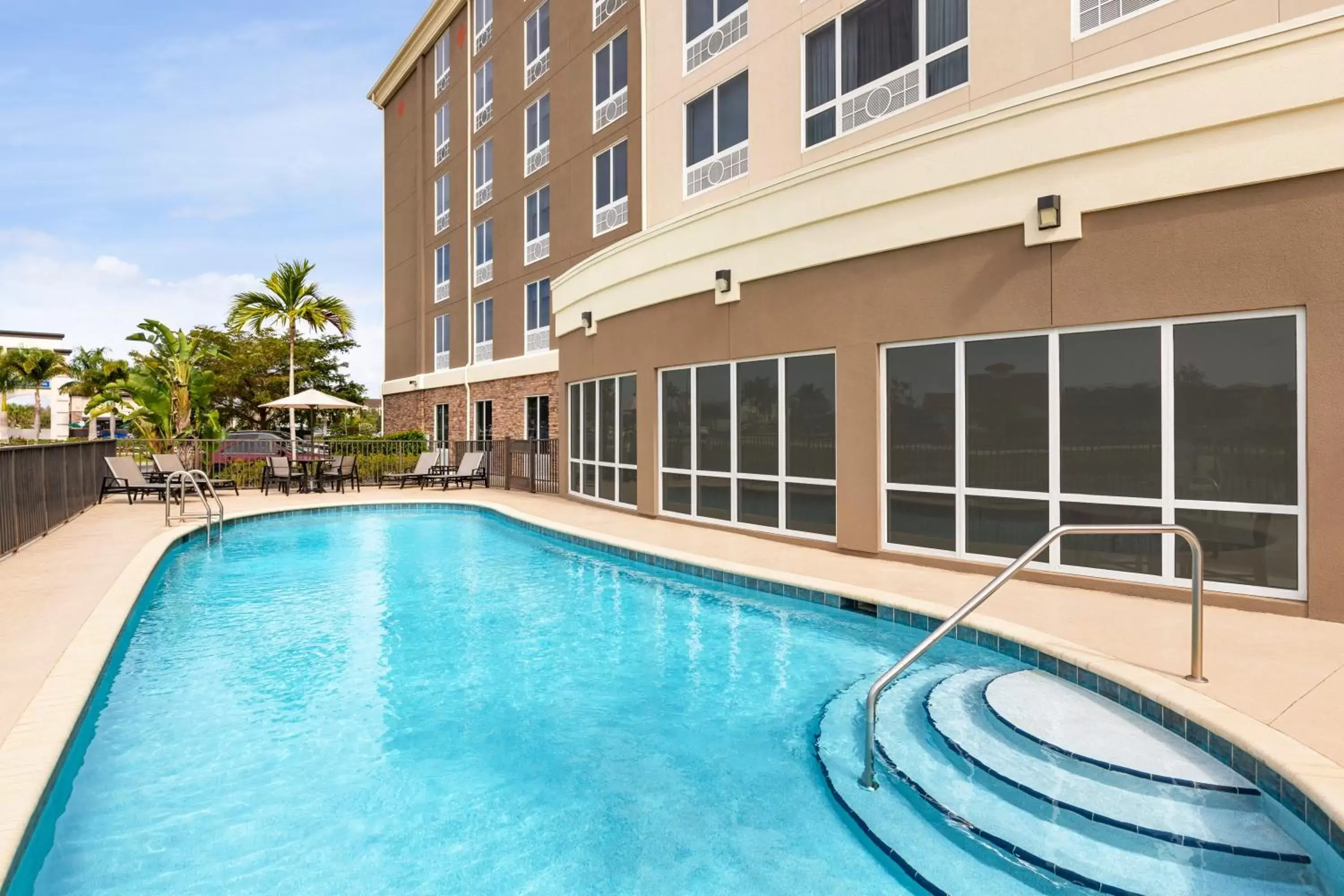 Swimming Pool in Holiday Inn Express Hotel & Suites Fort Myers East - The Forum, an IHG Hotel