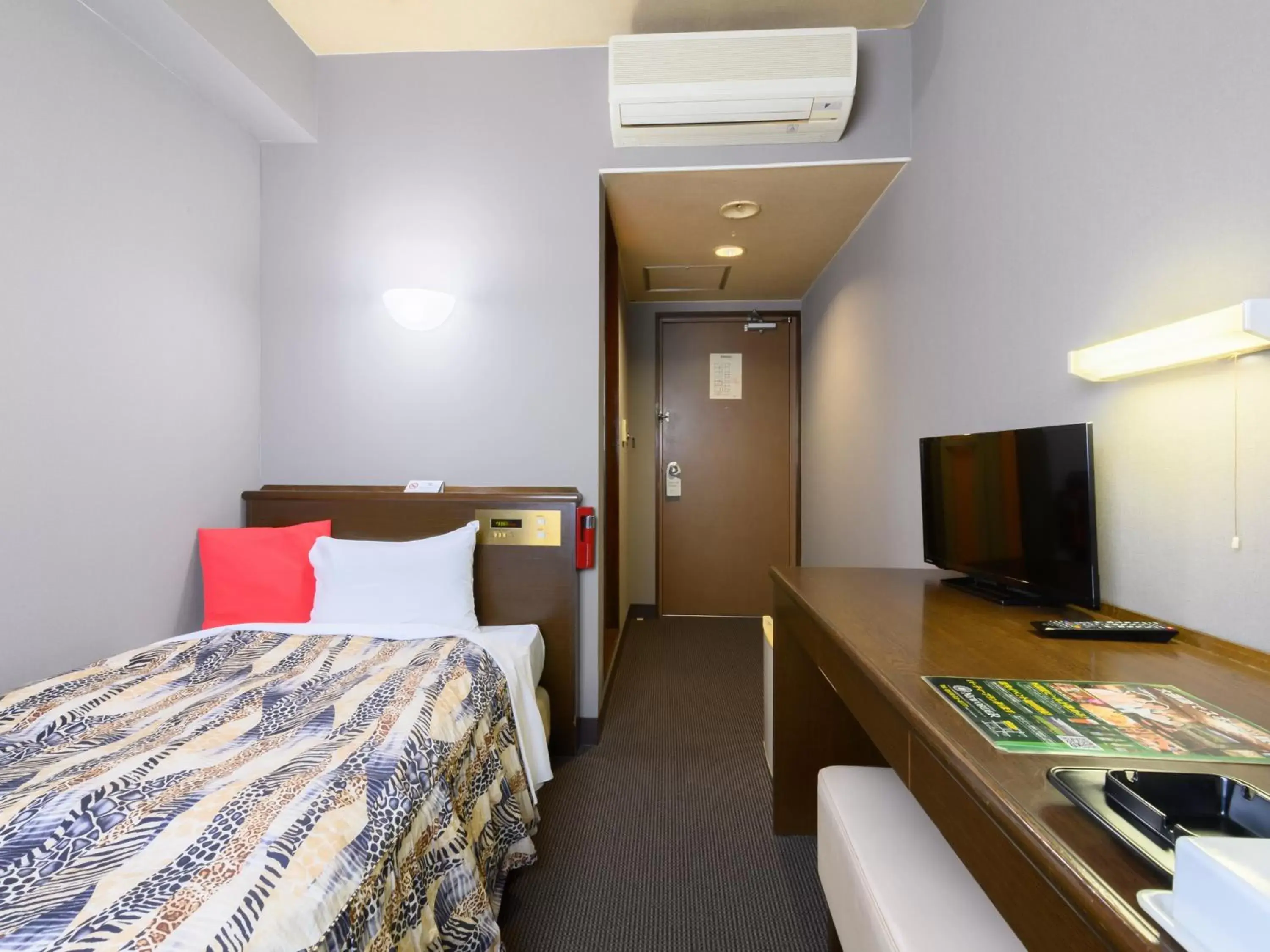 Bedroom, TV/Entertainment Center in Tabist IWATA Station Hotel