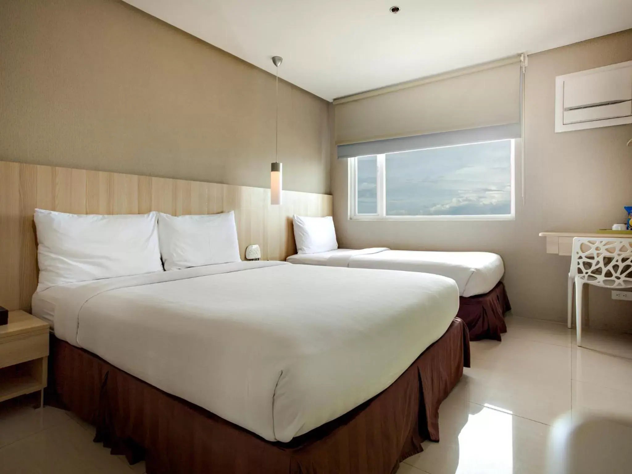 Bed in Injap Tower Hotel