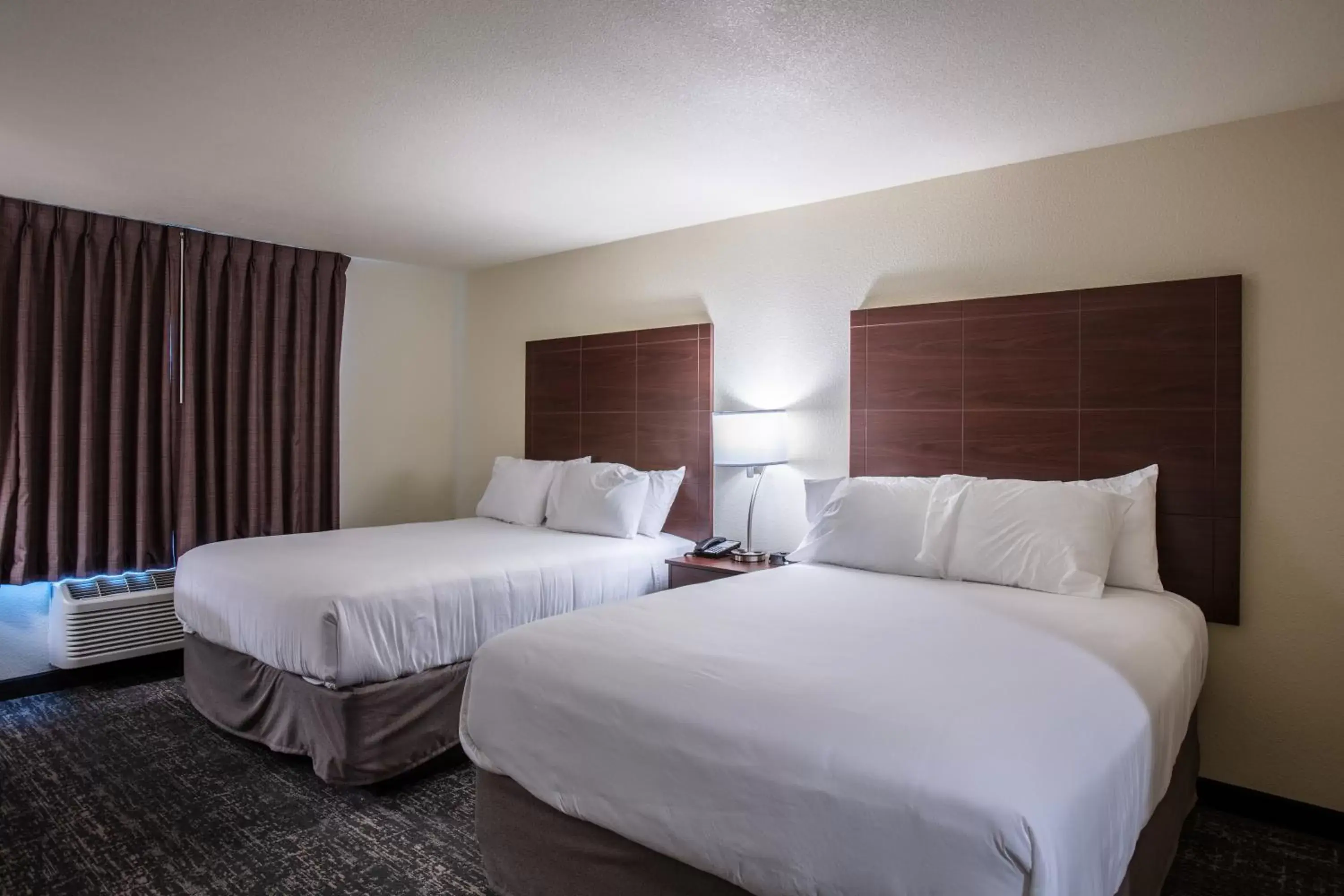 Bed in Cobblestone Inn & Suites - Pine Bluffs