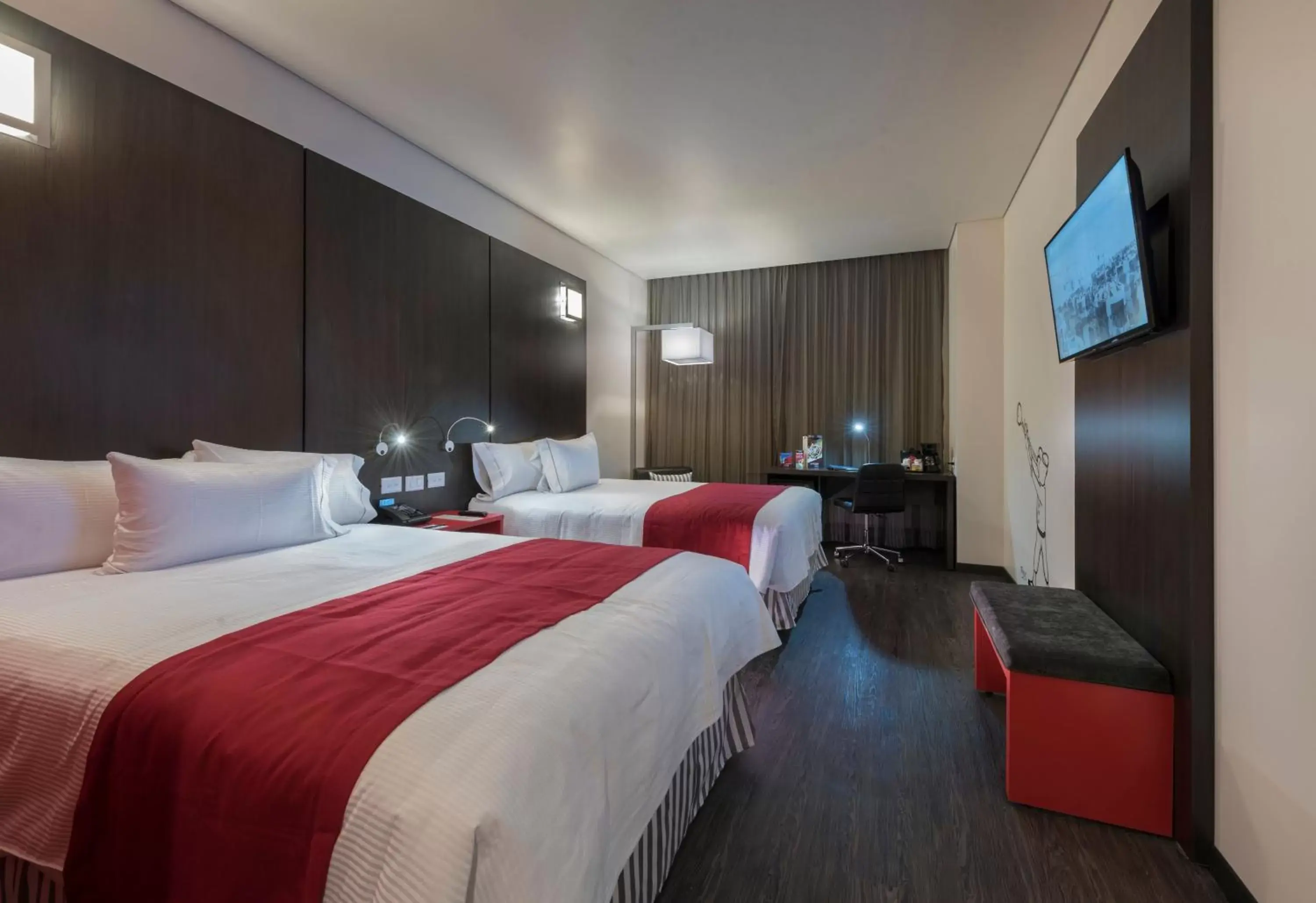 Bed in Ramada Encore by Wyndham Puebla