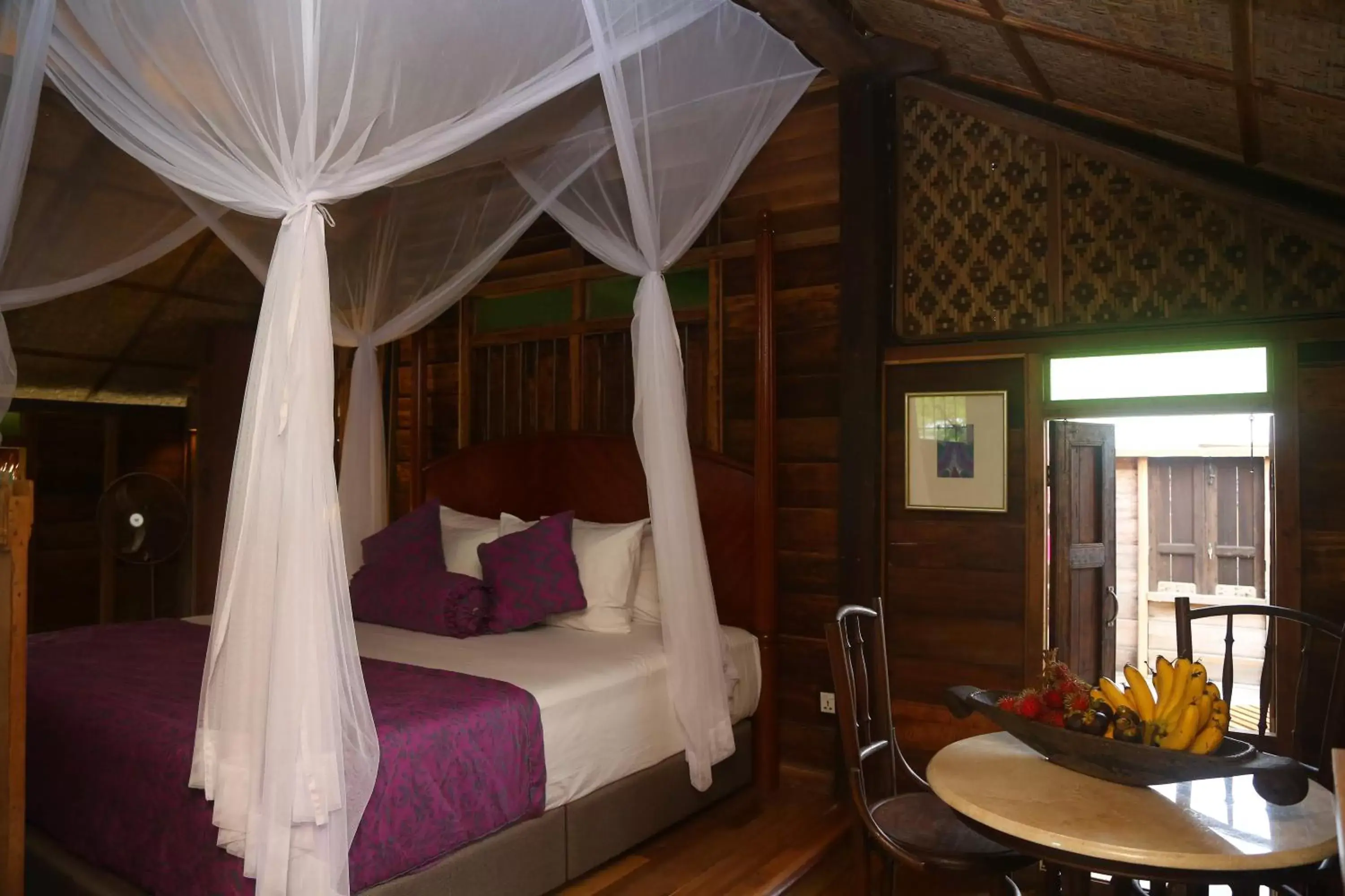 Bed in Kunang Kunang Heritage Villas