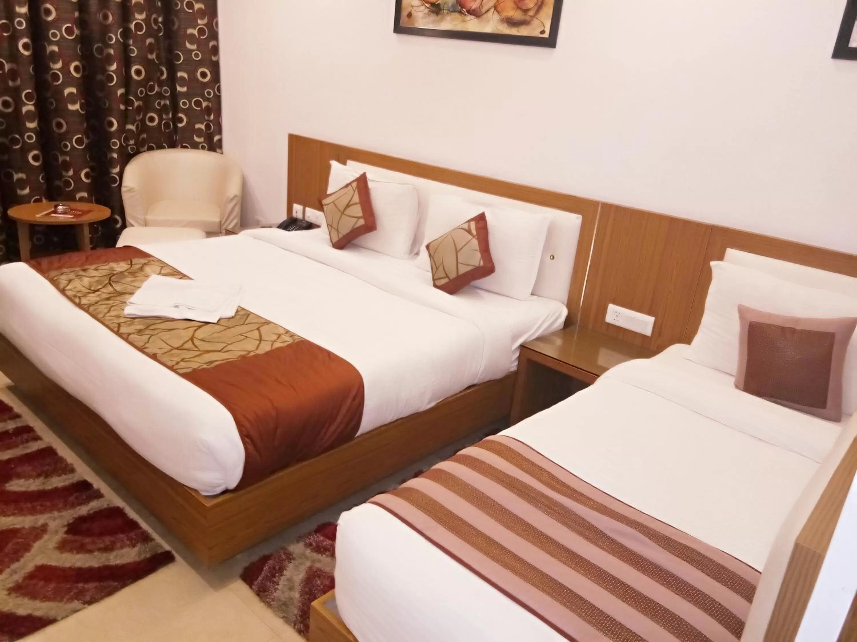 Bed in Hotel Suktara International