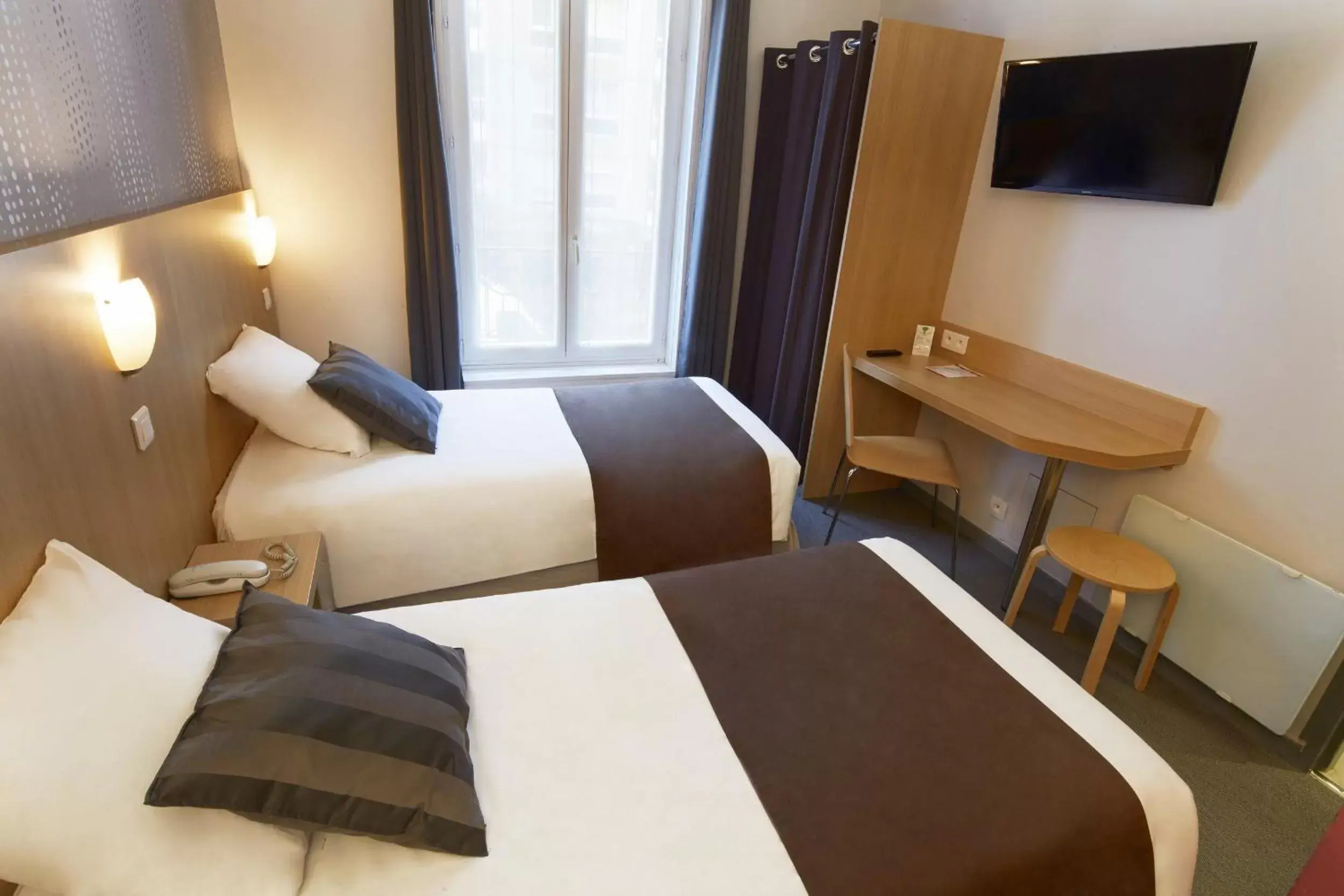 Photo of the whole room, Bed in Hotel Paris Villette