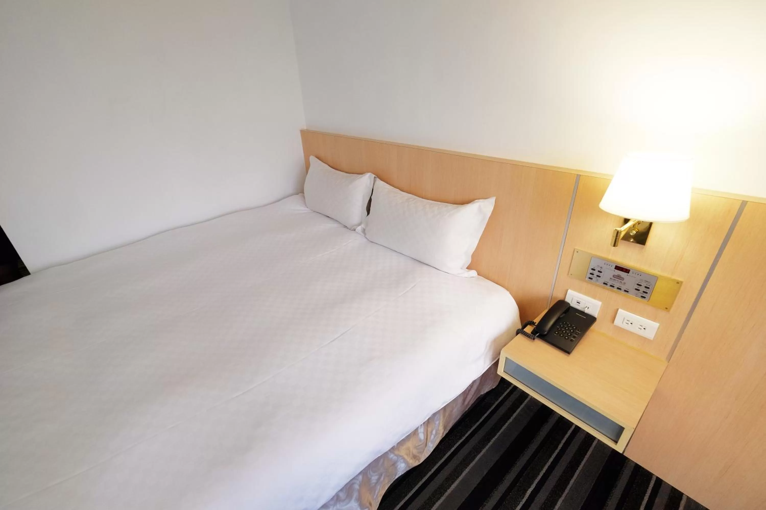 Bed in Dynasty Hotel