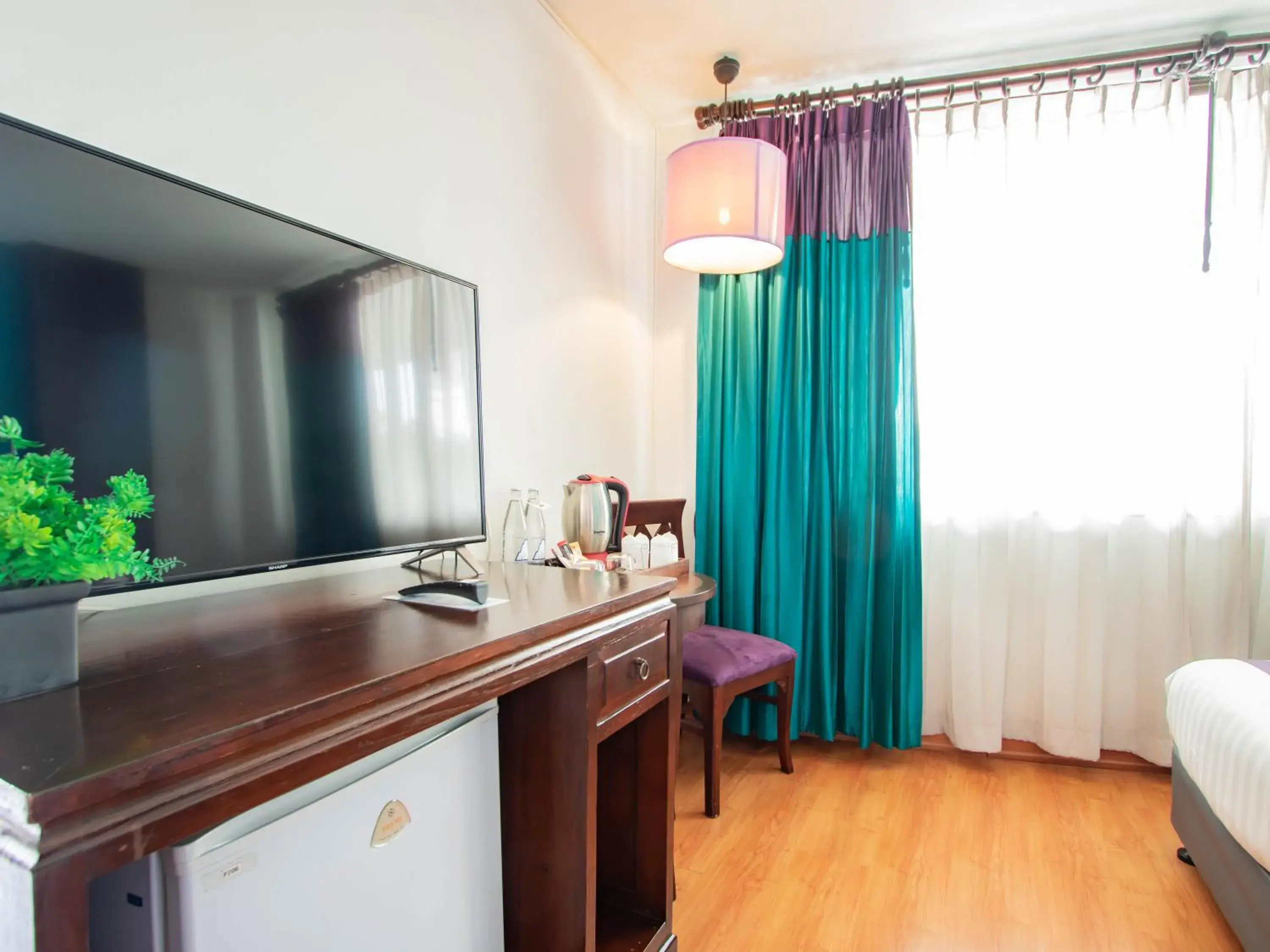 TV and multimedia, TV/Entertainment Center in Eurana Boutique Hotel