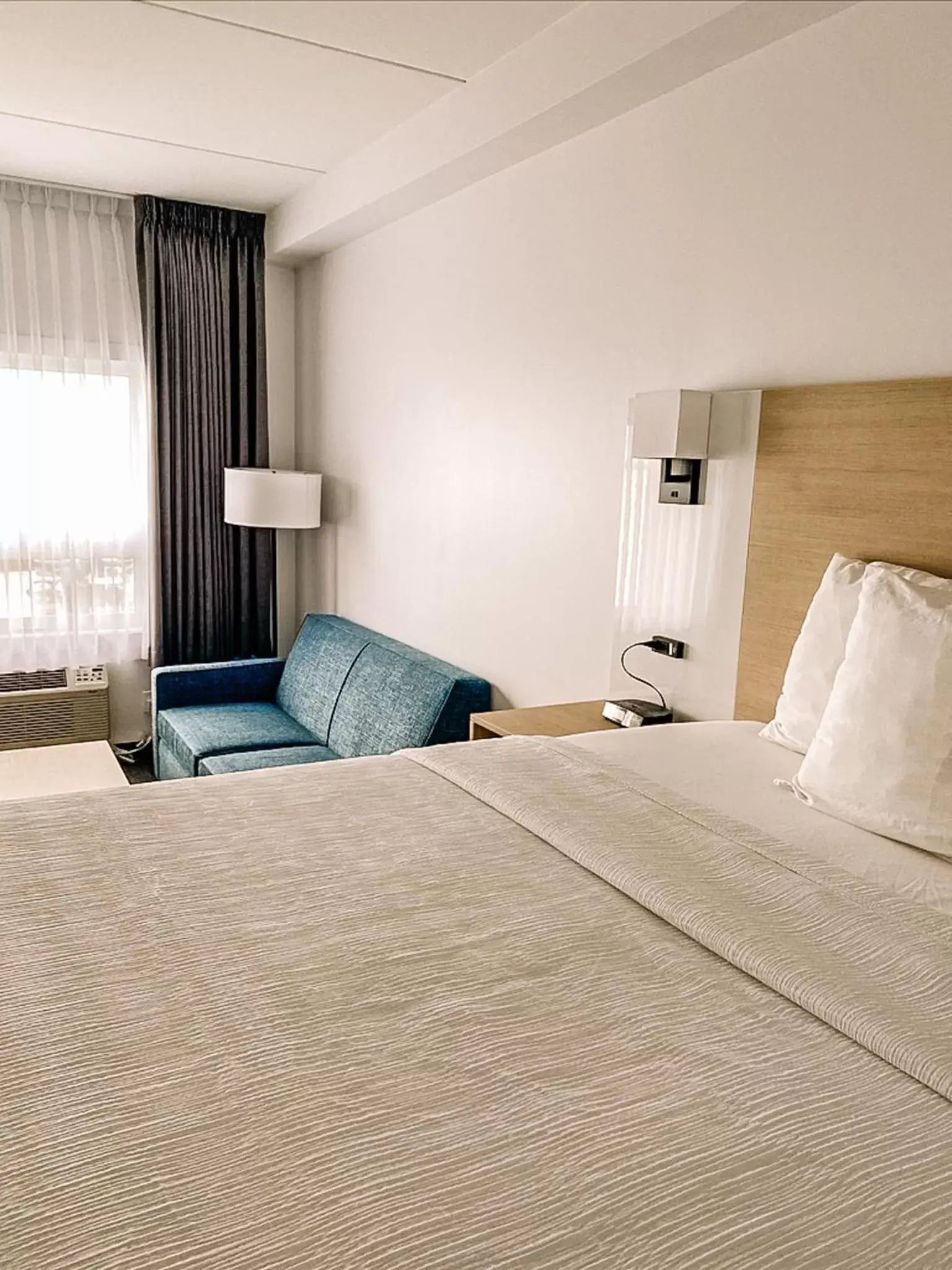 Bed in La Place Rendez-Vous Hotel