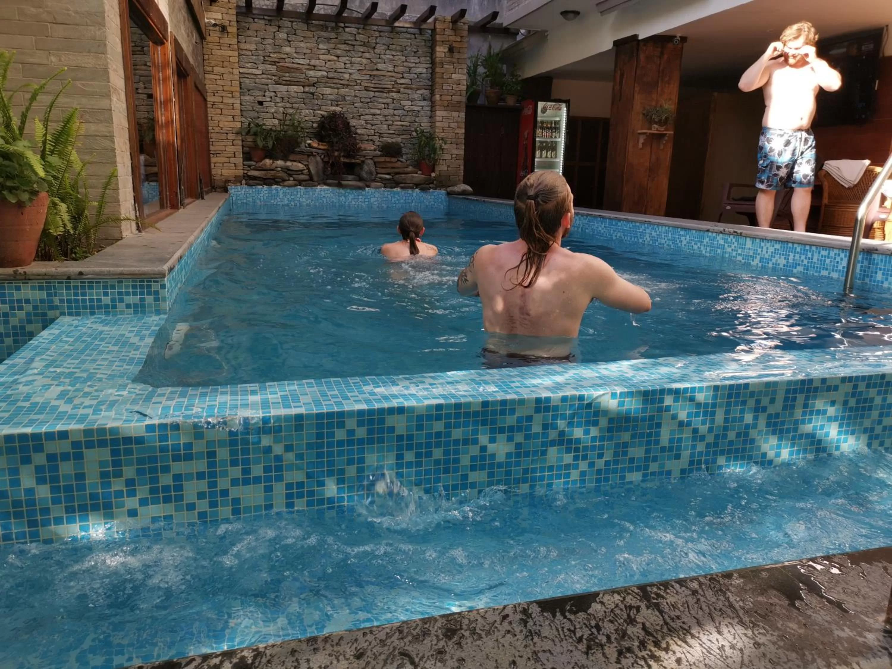 Swimming pool in Hotel Middle Path & Spa