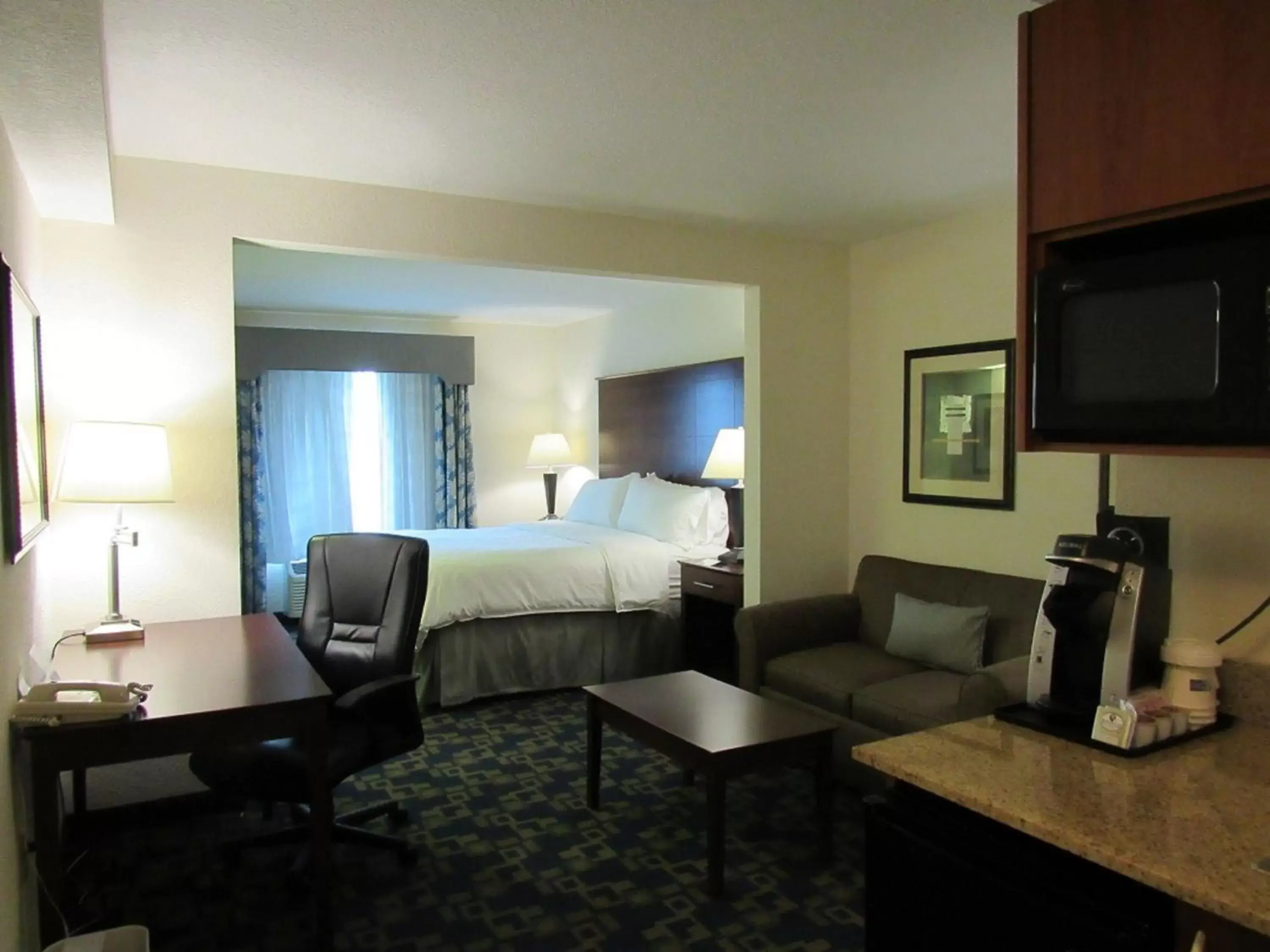 Photo of the whole room, TV/Entertainment Center in Holiday Inn Express & Suites Pembroke Pines-Sheridan St, an IHG Hotel