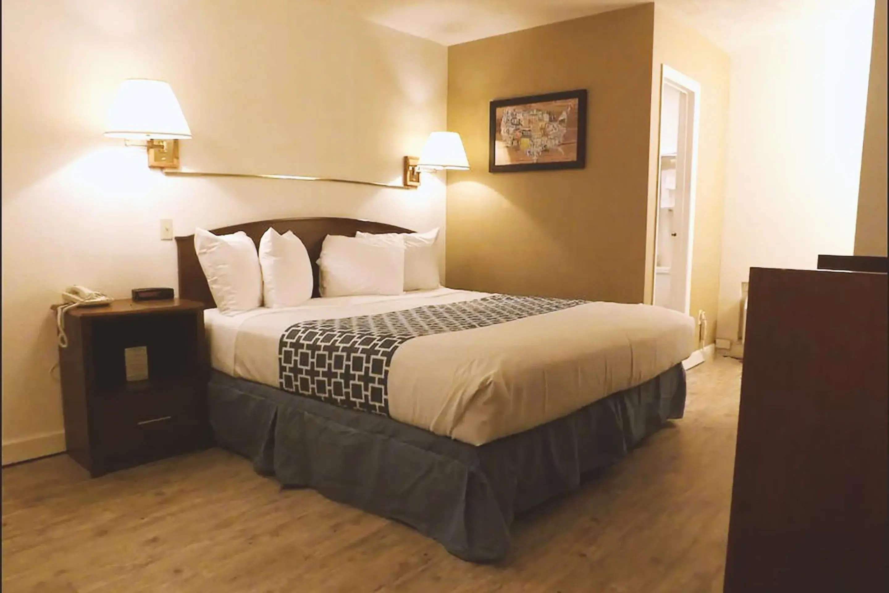 Bed in Coratel Inn & Suites by Jasper McCook