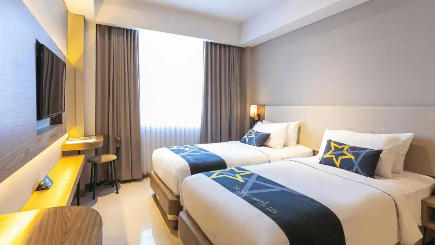 Bed in Yellow Star Ambarukmo Hotel