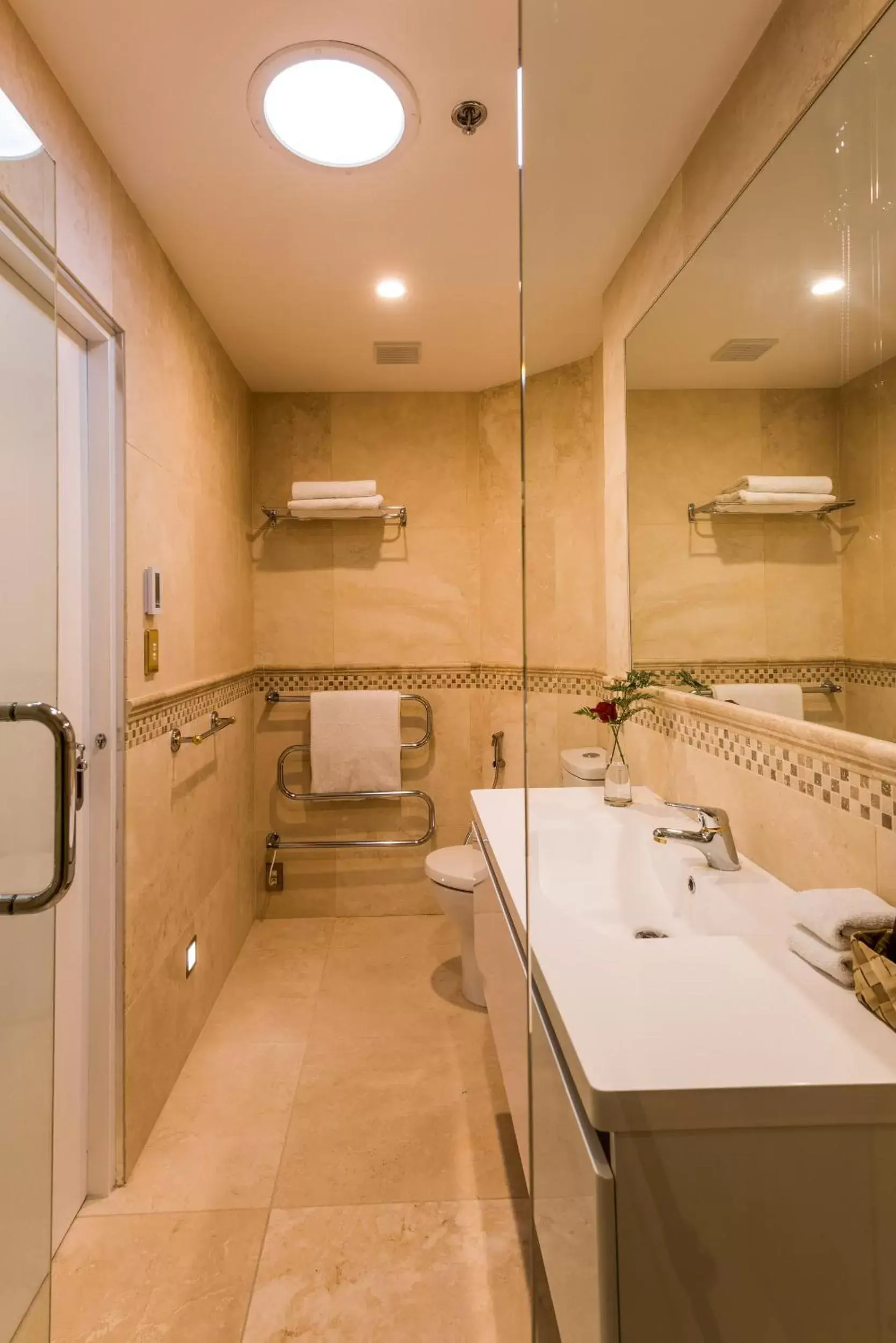 Bathroom in Fino Hotel & Suites