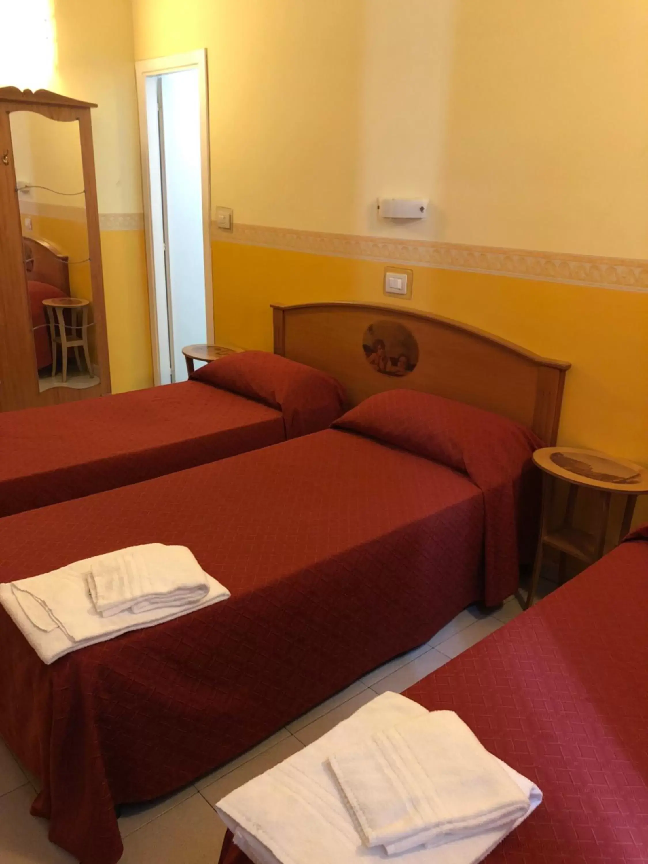 Bed in Hotel Cherubini