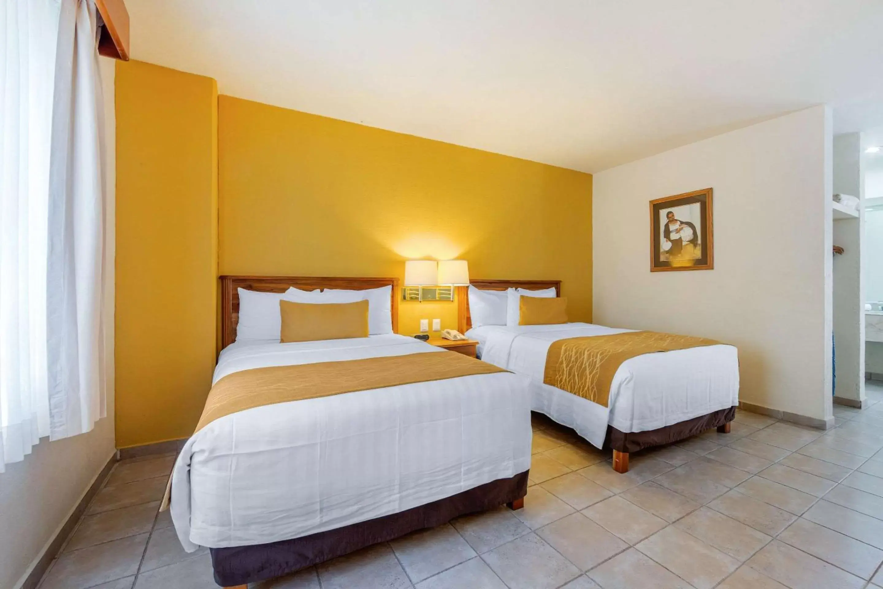 Photo of the whole room, Bed in Comfort Inn Tampico