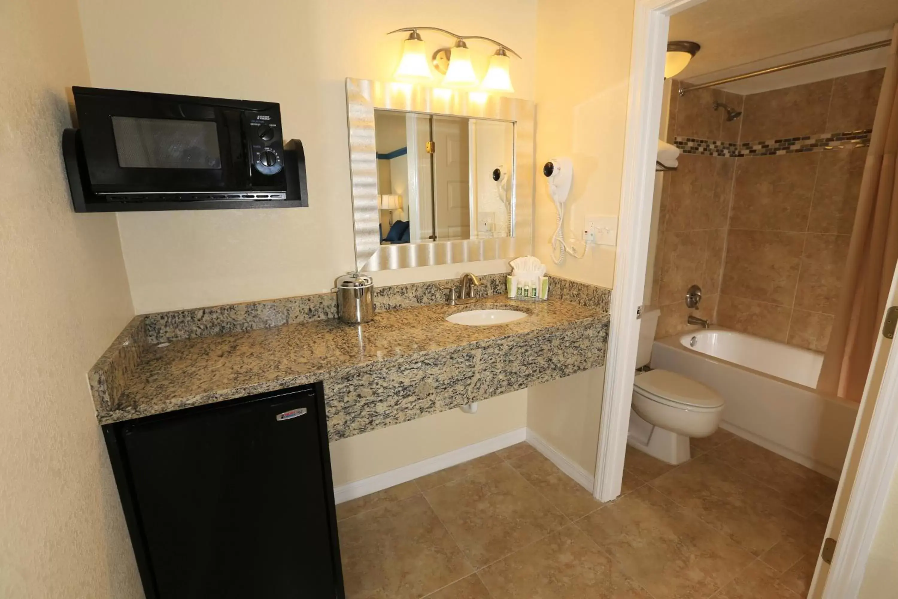 Bathroom in SureStay Plus by Best Western Orlando International Drive