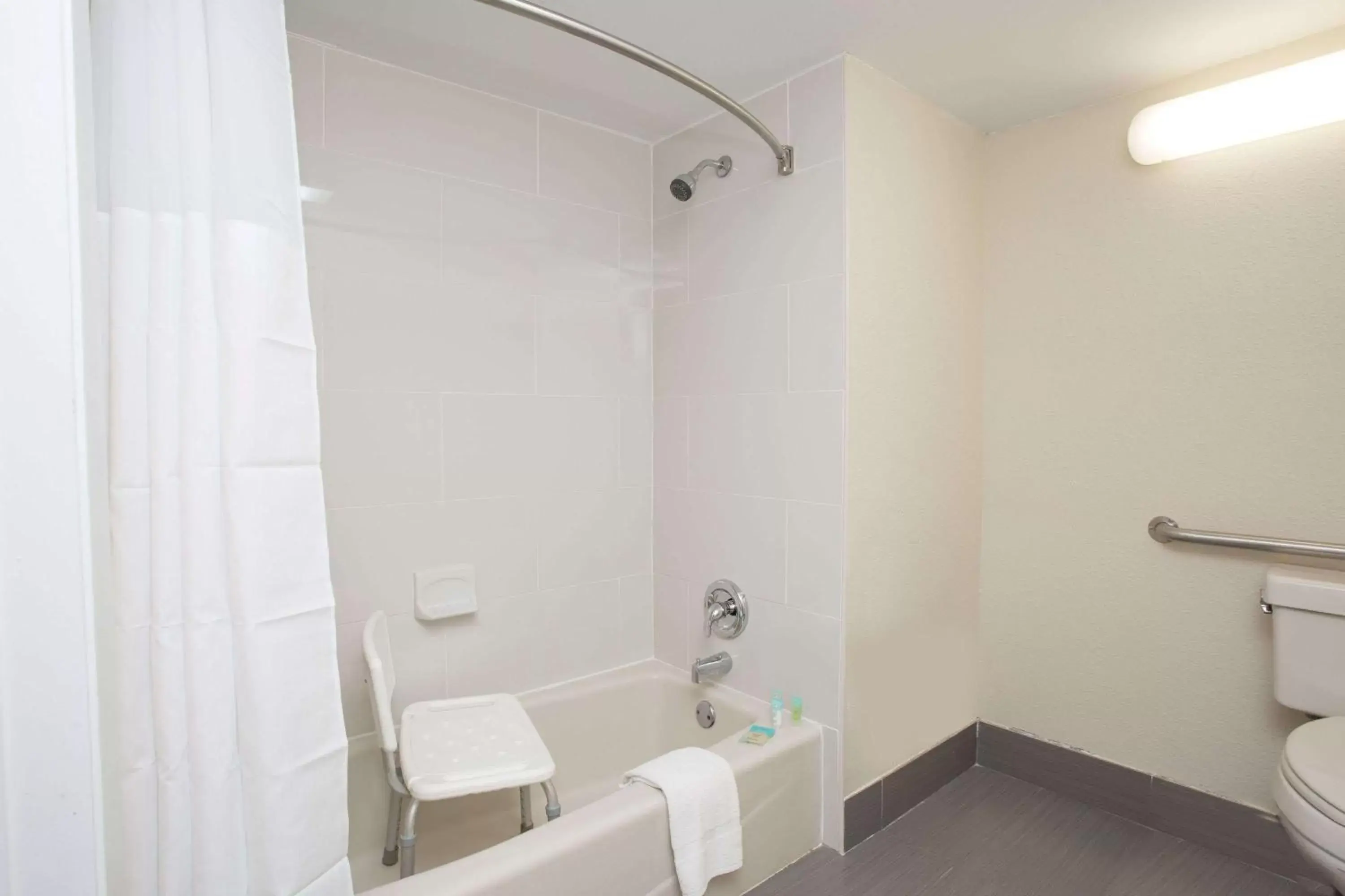 Bathroom in Days Inn & Suites by Wyndham Orlando Airport