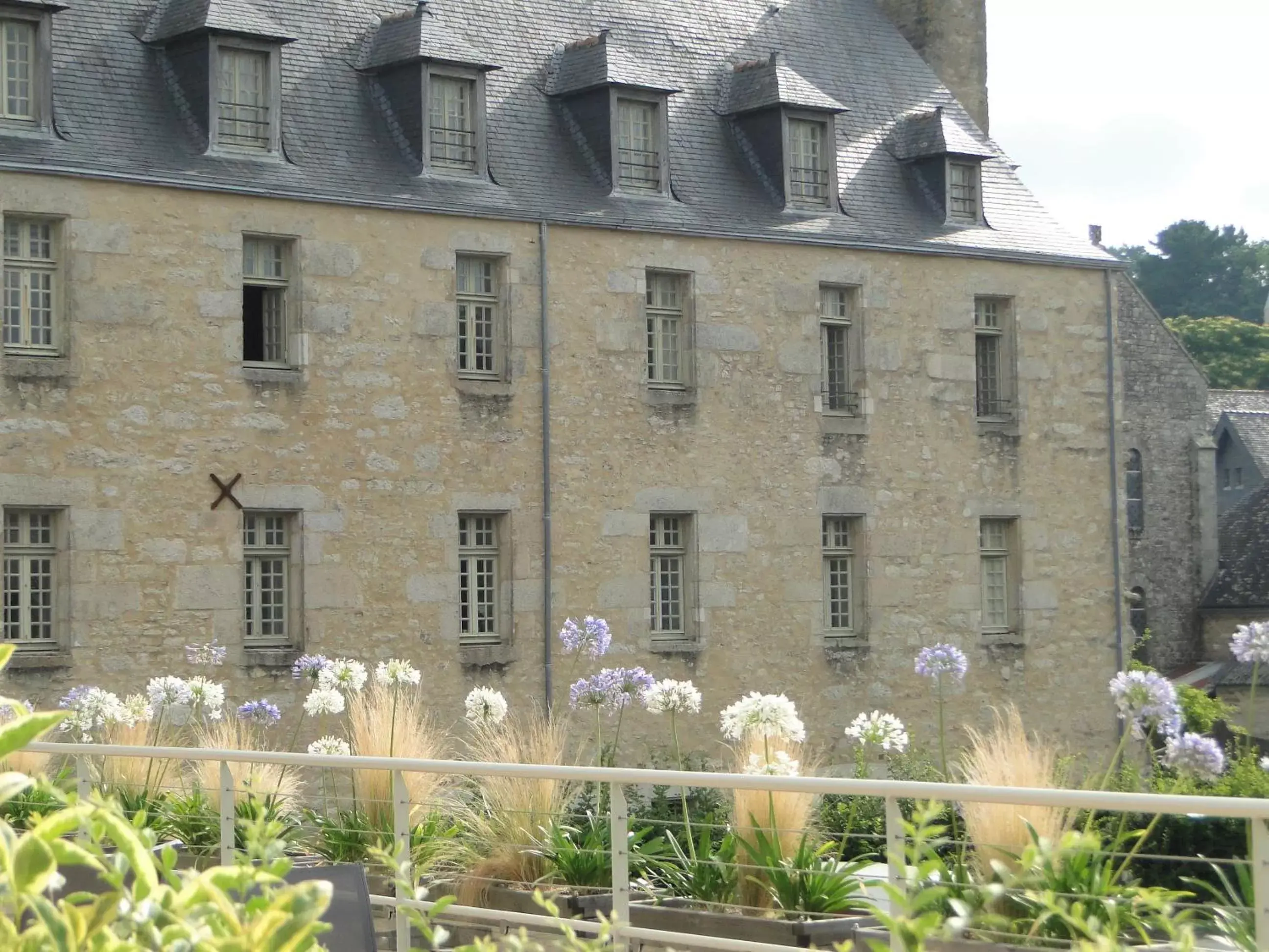 Garden view, Property Building in Hôtel Ginkgo - SPA Biloba