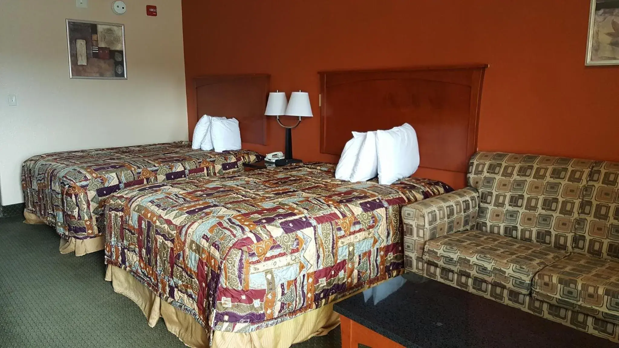 Bed in Budgetel Inn and Suites