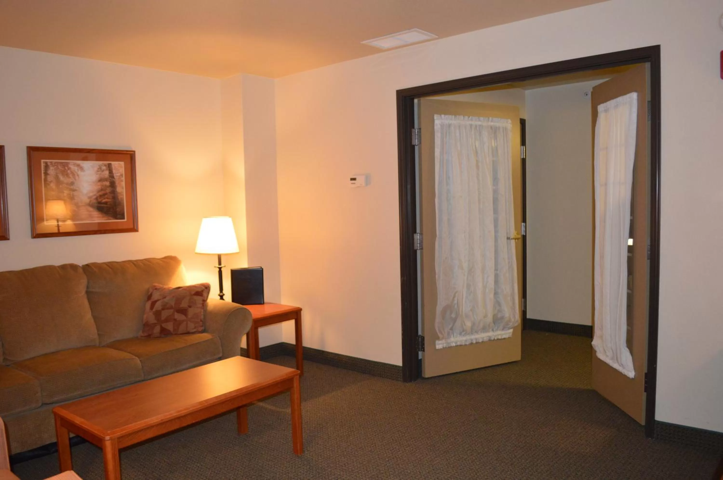 Living room in AmericInn by Wyndham Havre