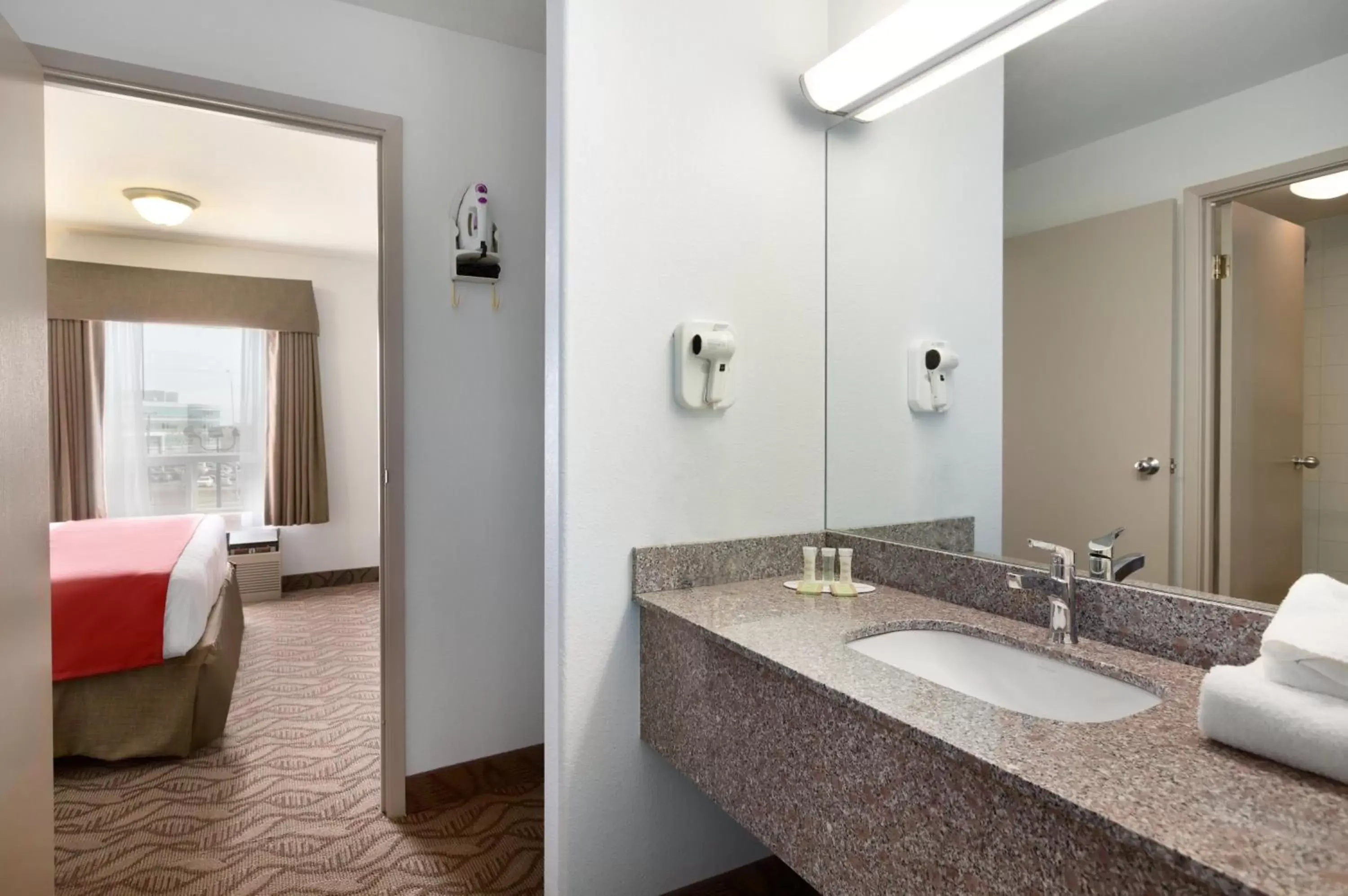 Bathroom in Super 8 by Wyndham Calgary Shawnessy Area