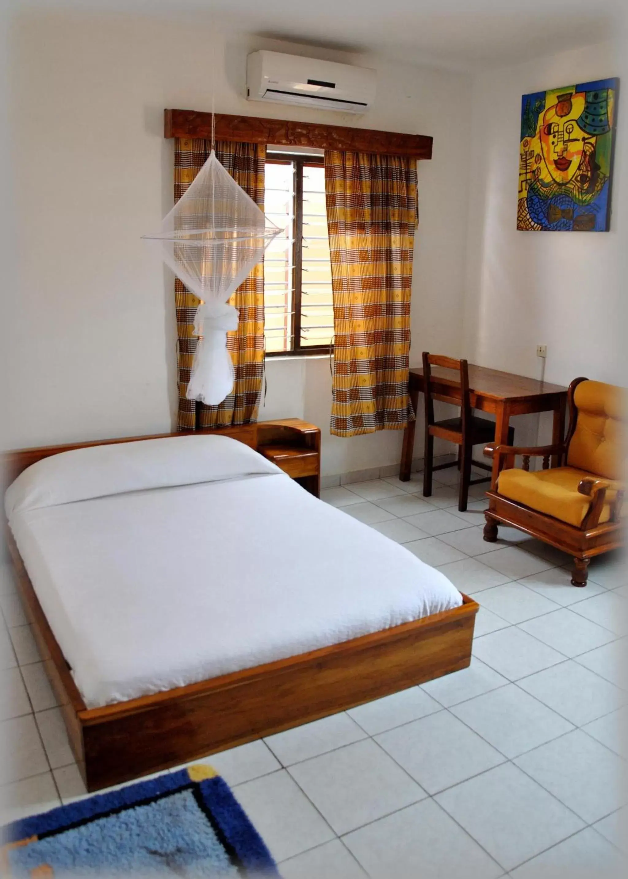 Photo of the whole room, Bed in Hotel Aurore Lomé