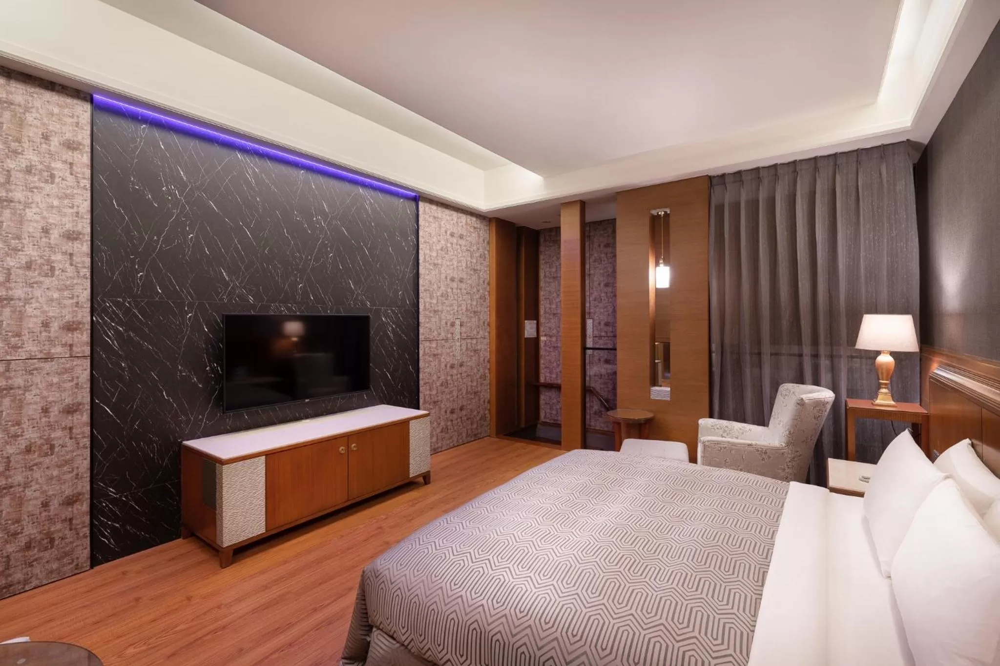 Bed in Purple Garden Motel