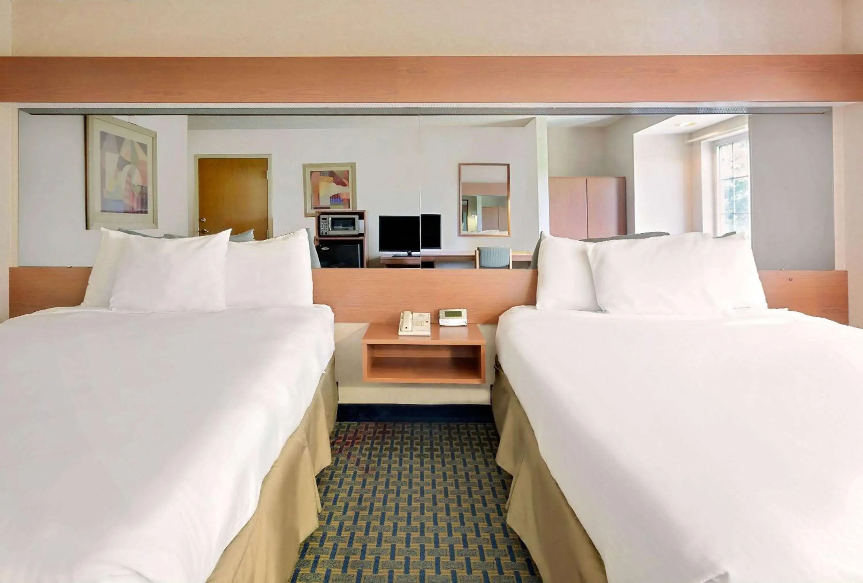 Photo of the whole room, Bed in Microtel Inn by Wyndham Winston-Salem