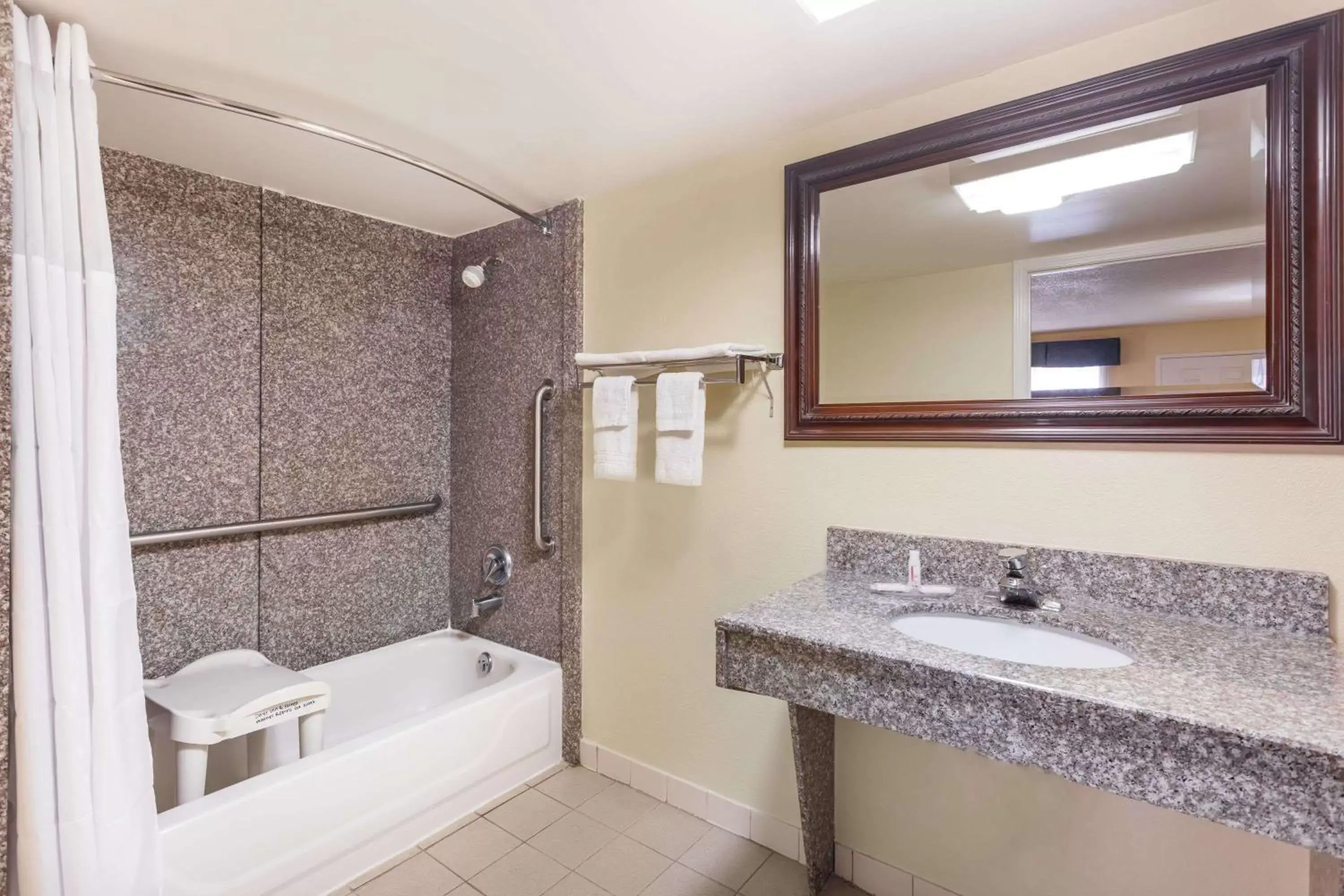 Bathroom in Days Inn & Suites by Wyndham Warner Robins Near Robins AFB