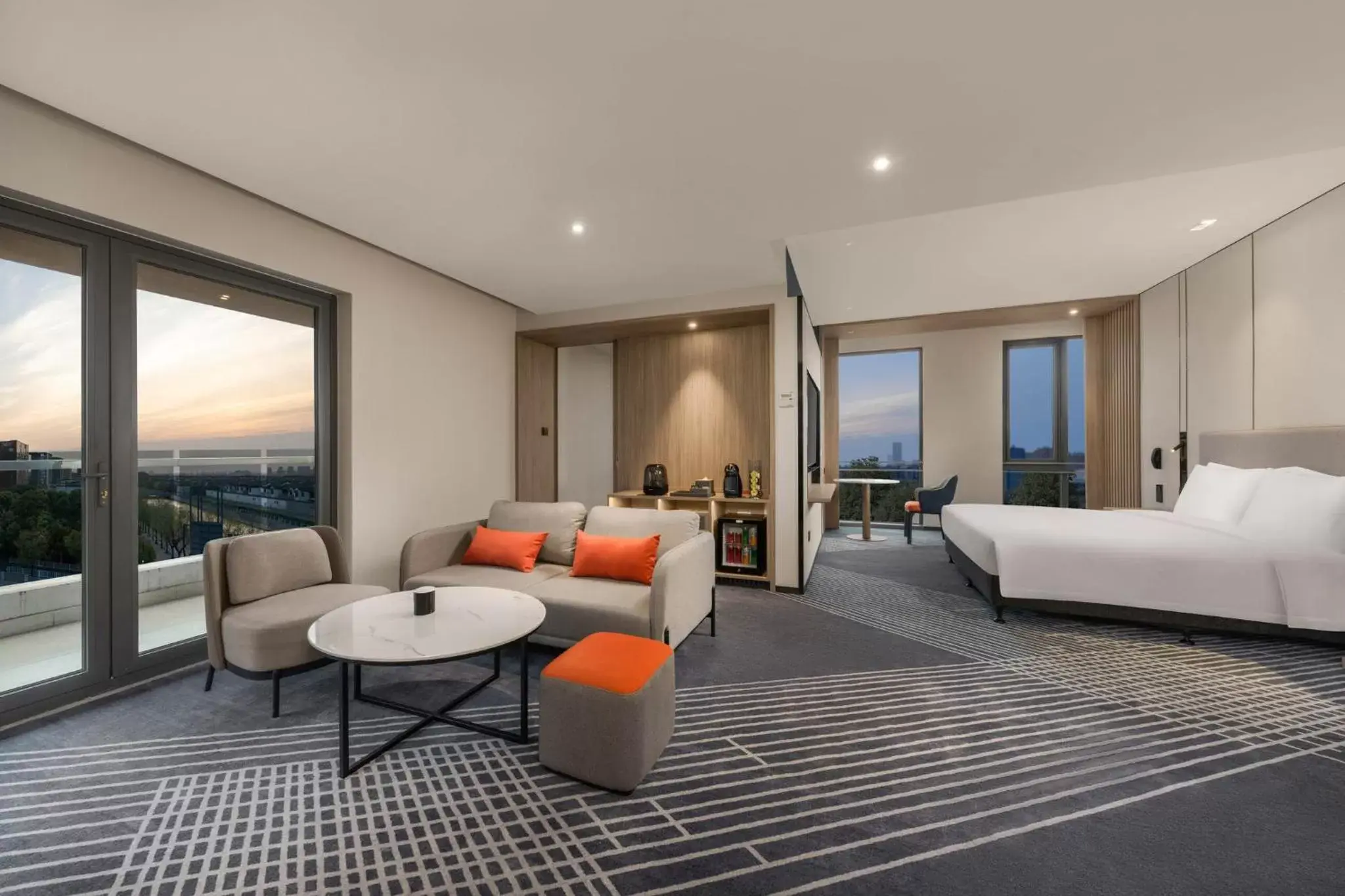 Photo of the whole room, Seating Area in Holiday Inn Express Shanghai Pujiang, an IHG Hotel