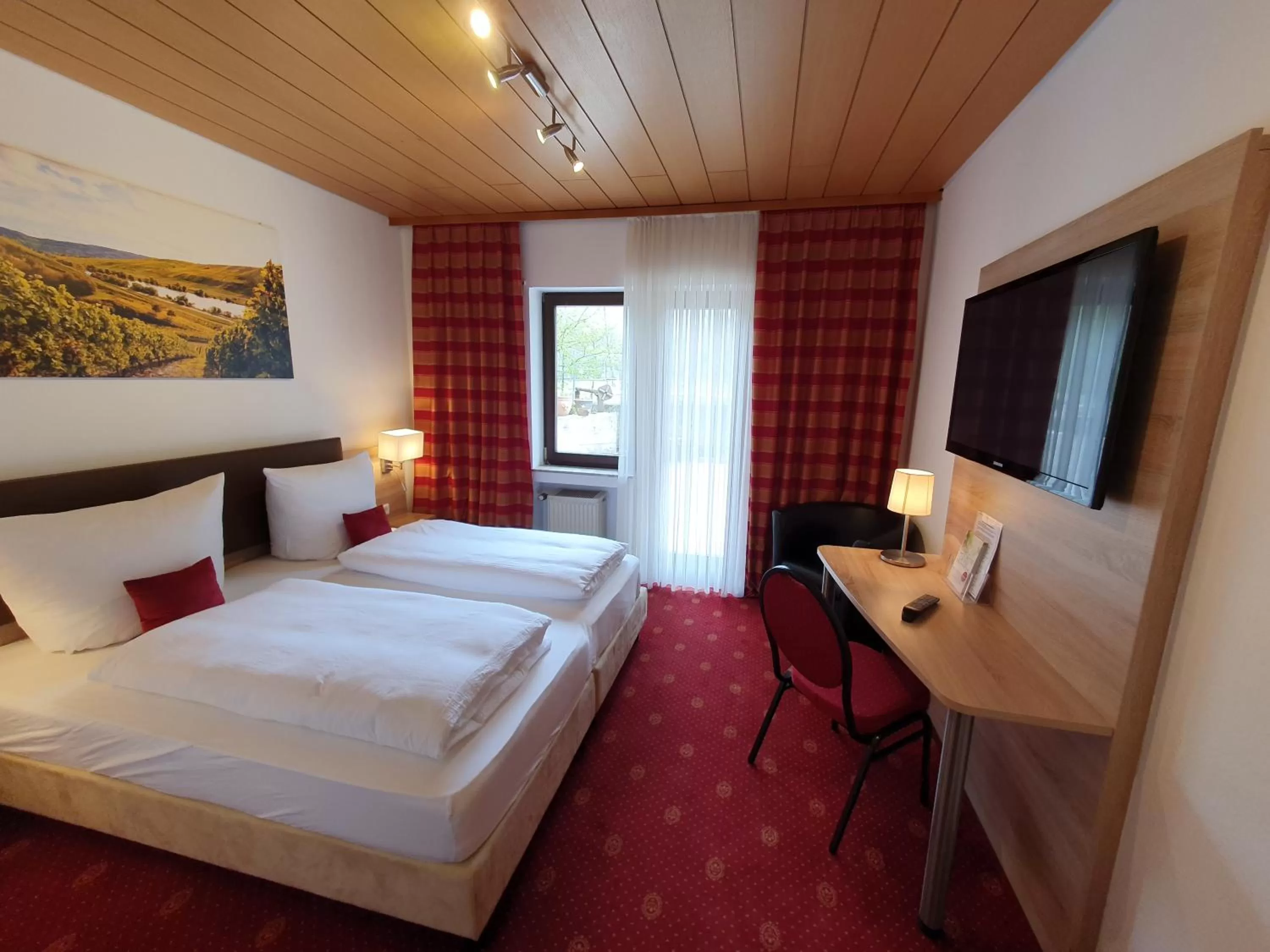 Photo of the whole room, Bed in Hotel und Weingut Karlsmühle