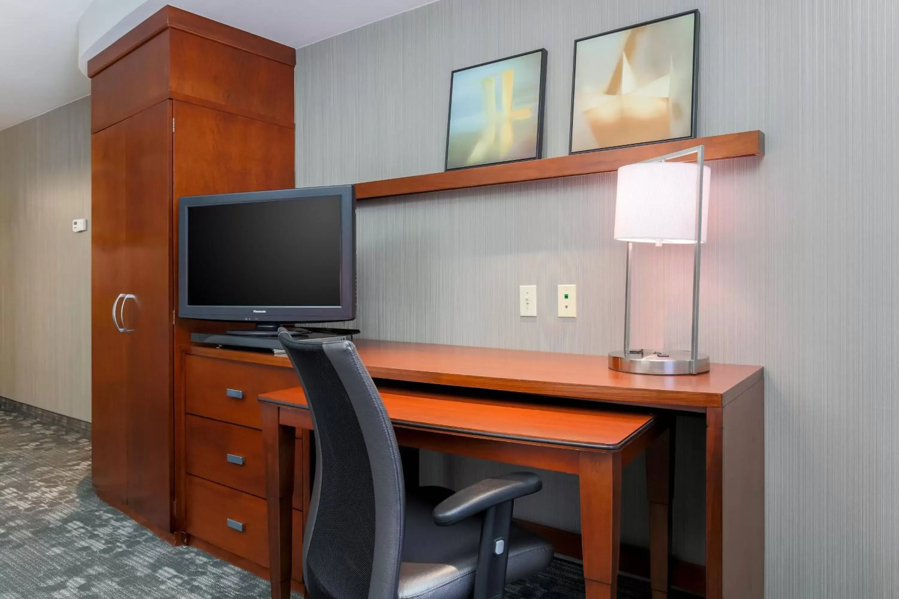 Photo of the whole room, TV/Entertainment Center in Courtyard By Marriott Las Vegas Stadium Area