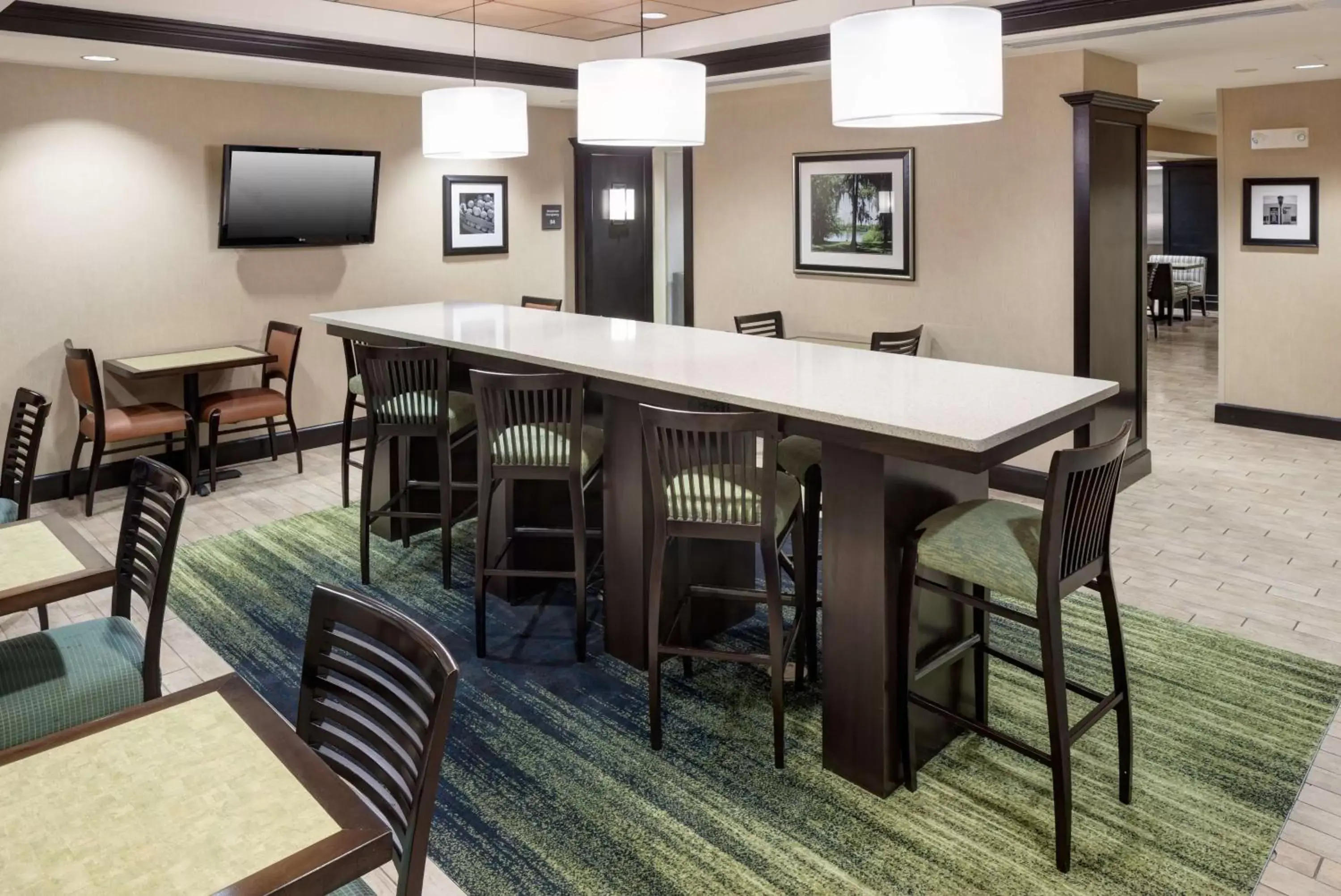 Lobby or reception in Hampton Inn & Suites Gainesville Downtown Lobby or reception in Hampton Inn & Suites Gainesville Downtown