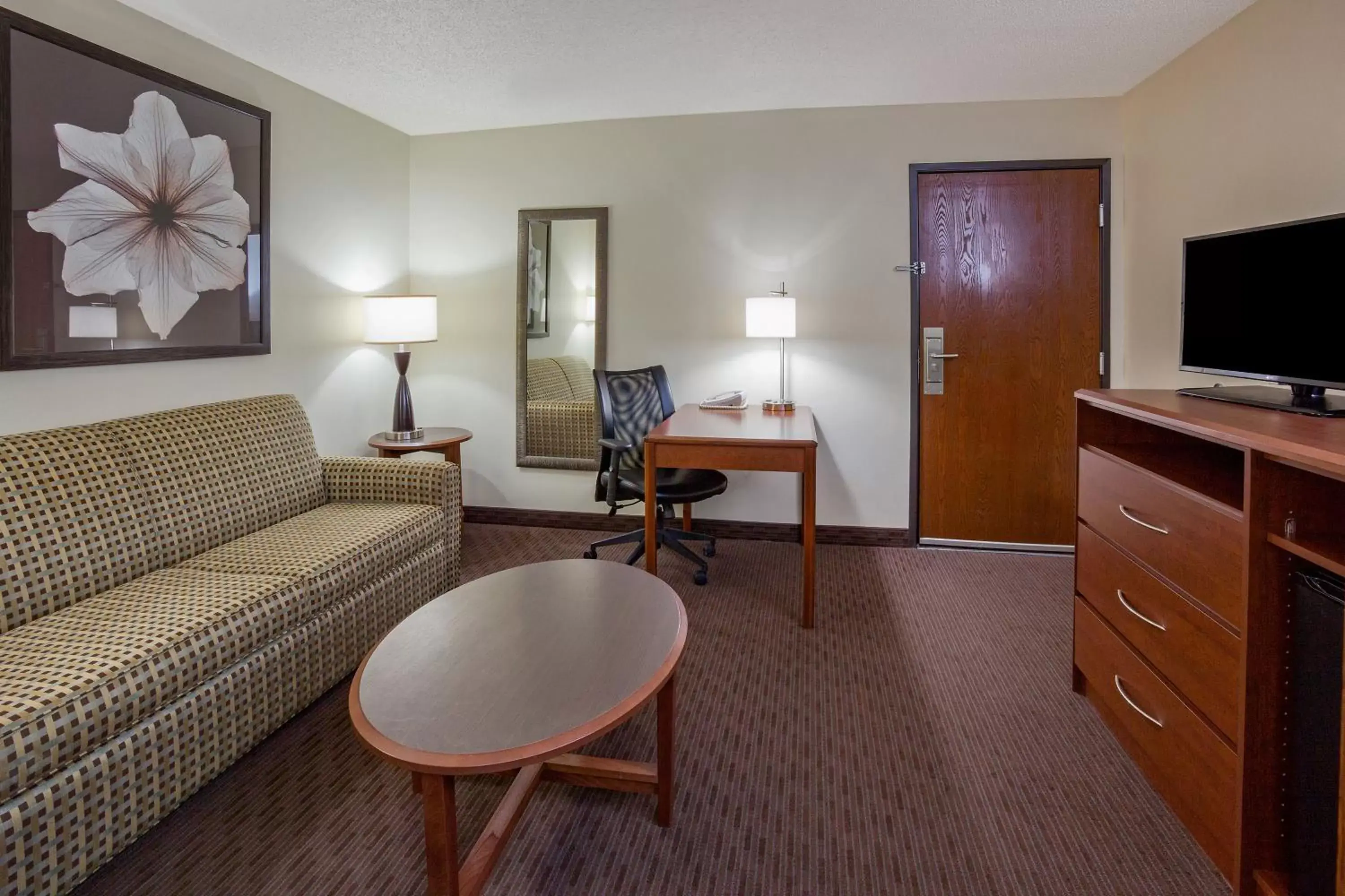 Photo of the whole room, Seating Area in AmericInn by Wyndham Spencer