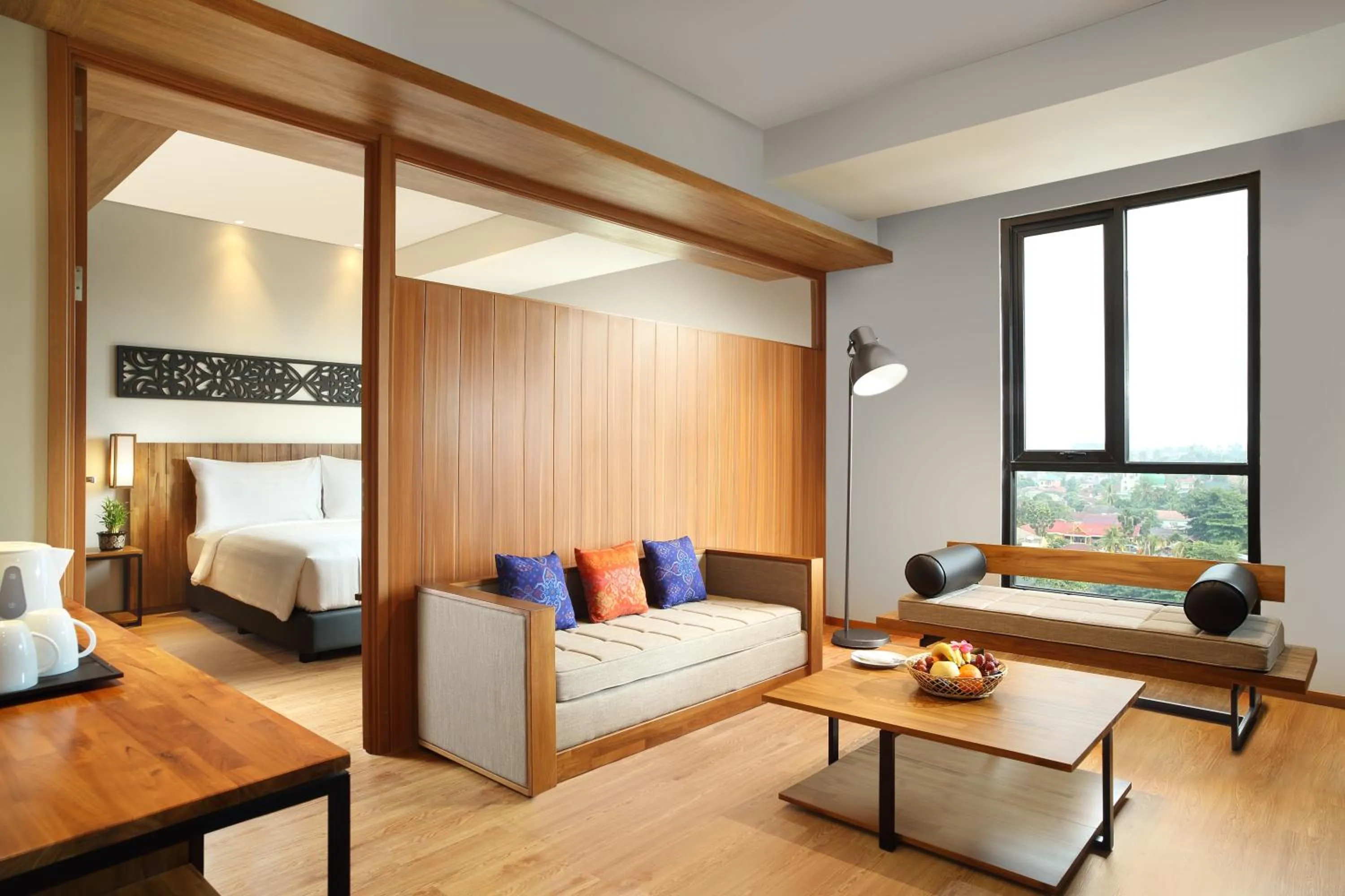 Living room, Bed in BATIQA Hotel Pekanbaru