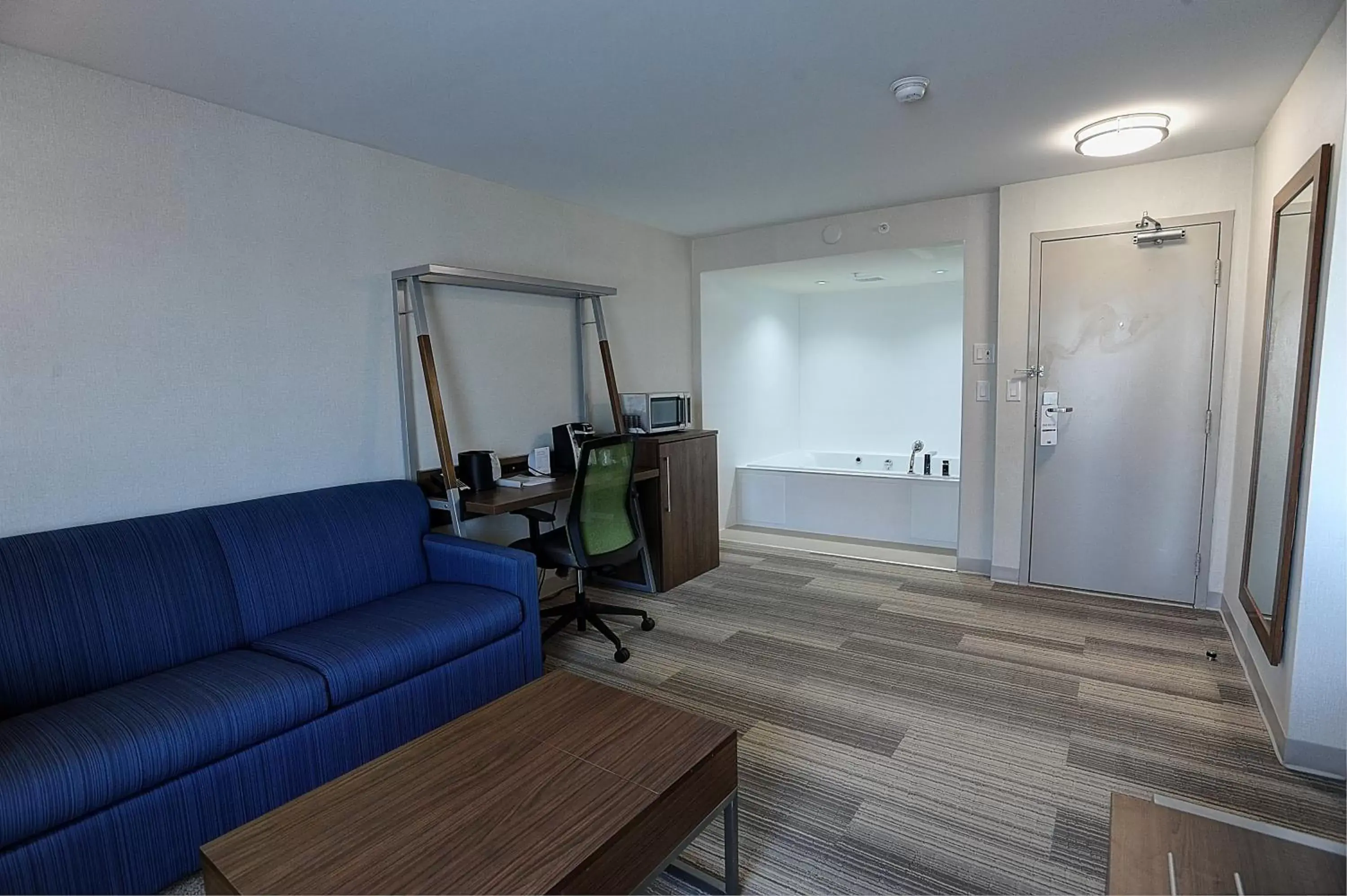 Bedroom, Seating Area in Holiday Inn Express & Suites Toronto Airport West, an IHG Hotel