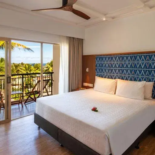 Bed in Outrigger Fiji Beach Resort