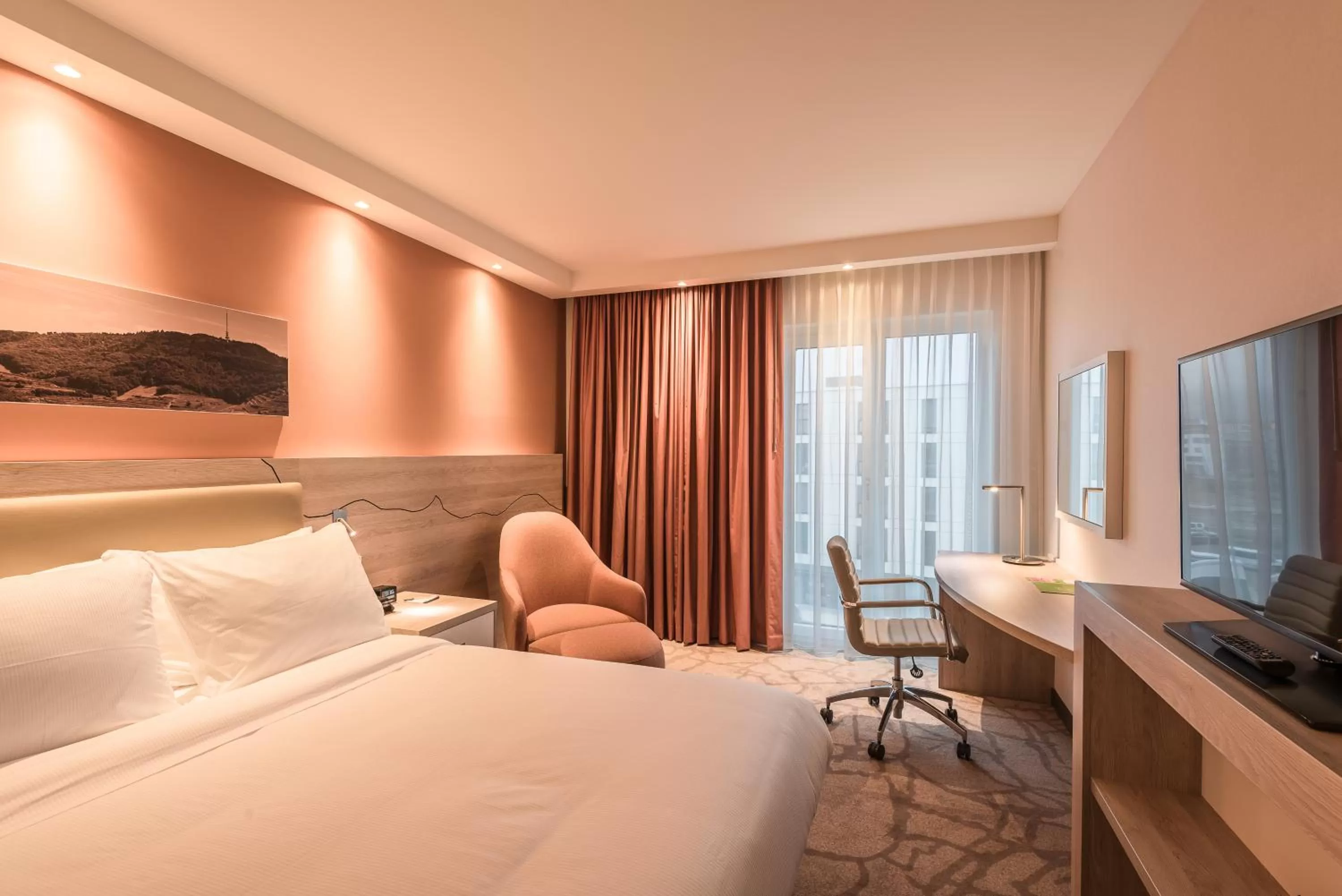 Communal lounge/ TV room, Bed in Hampton By Hilton Freiburg